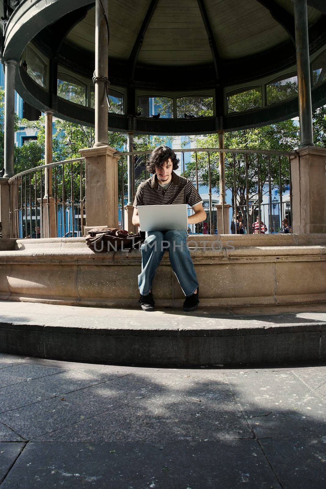 Young man sitting and using a laptop