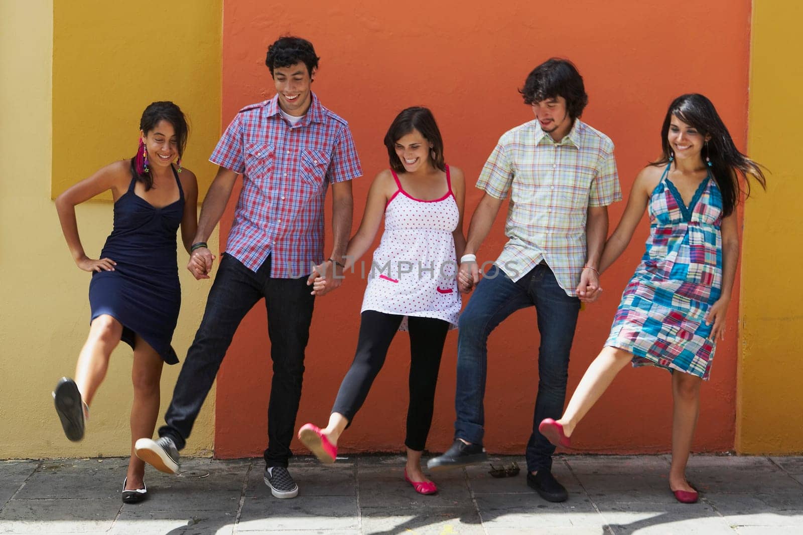 Two young men dancing with three young women, Puerto Rico