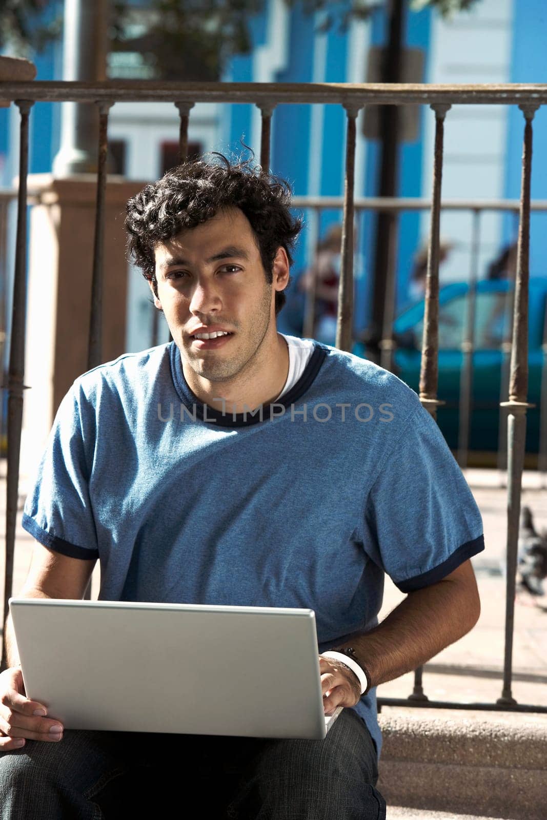 Portrait of a young man using a laptop