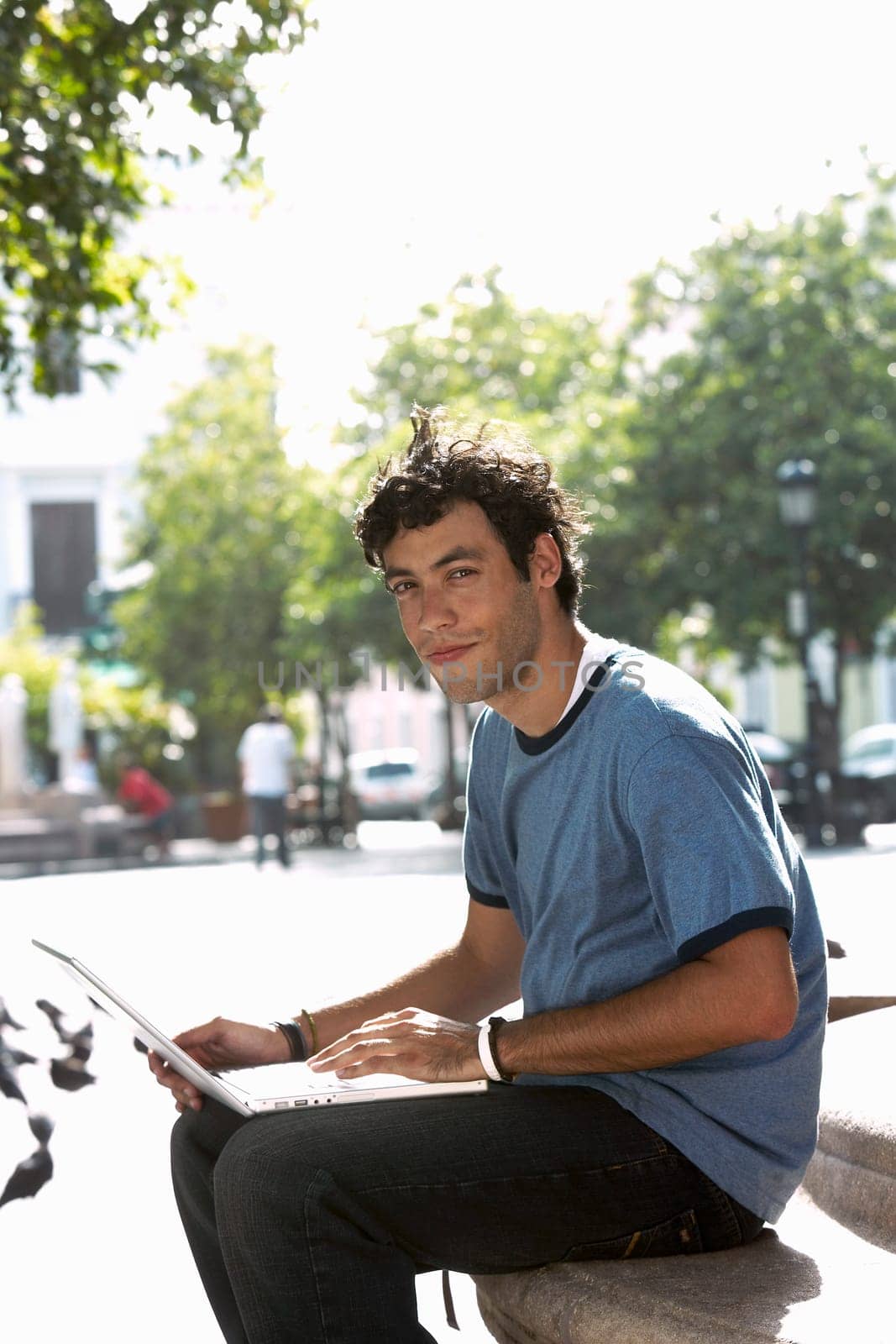 Portrait of a young man using a laptop