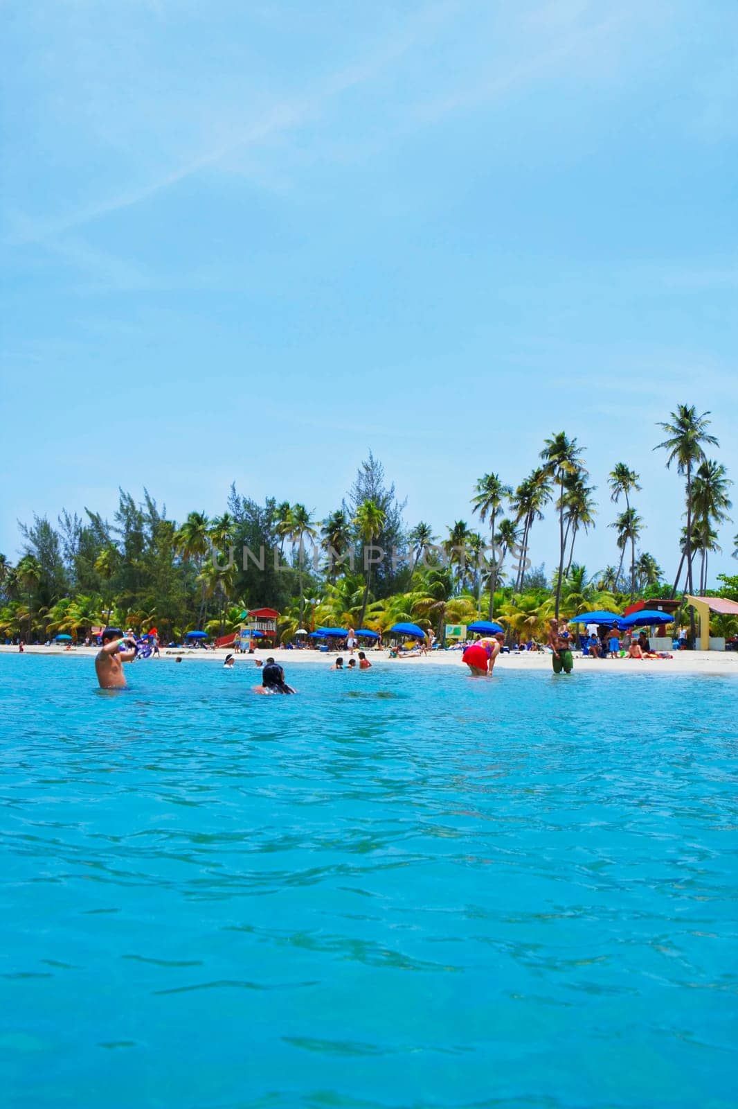 Group of people on the beach, Luquillo Beach, Puerto Rico