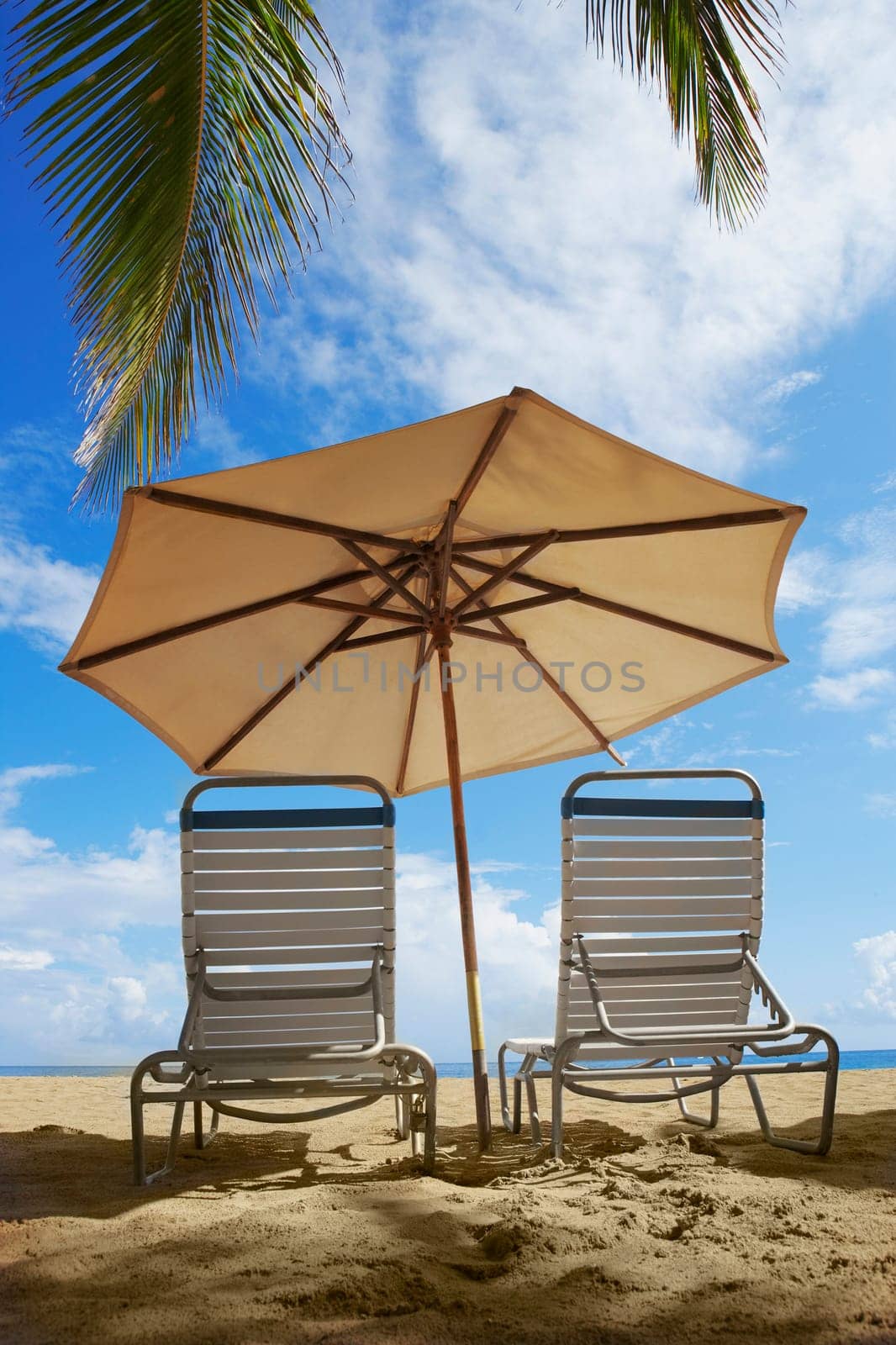 Two outdoor chairs and a beach umbrella on the beach, Ocean Park, El Condado, San Juan, Puerto Rico