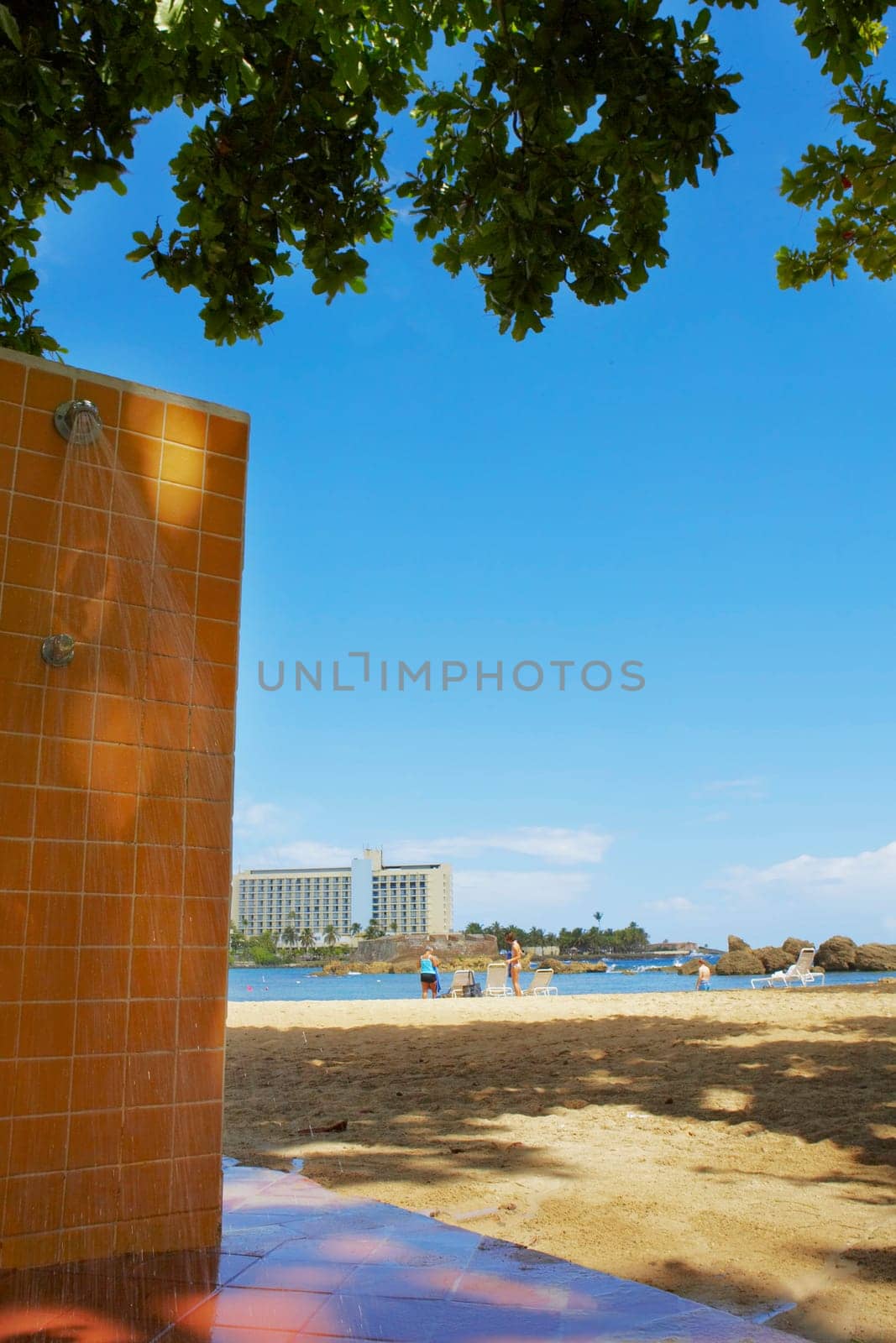 Outdoor showers on an empty beach, Condado Beach, San Juan, Puerto Rico
