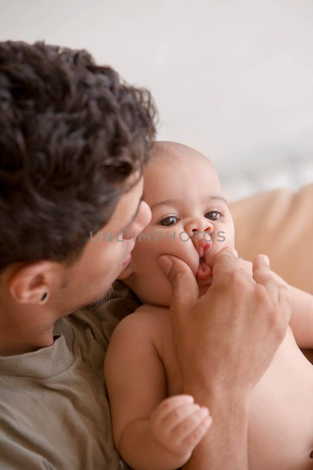 Close-up of a young man playing with his son