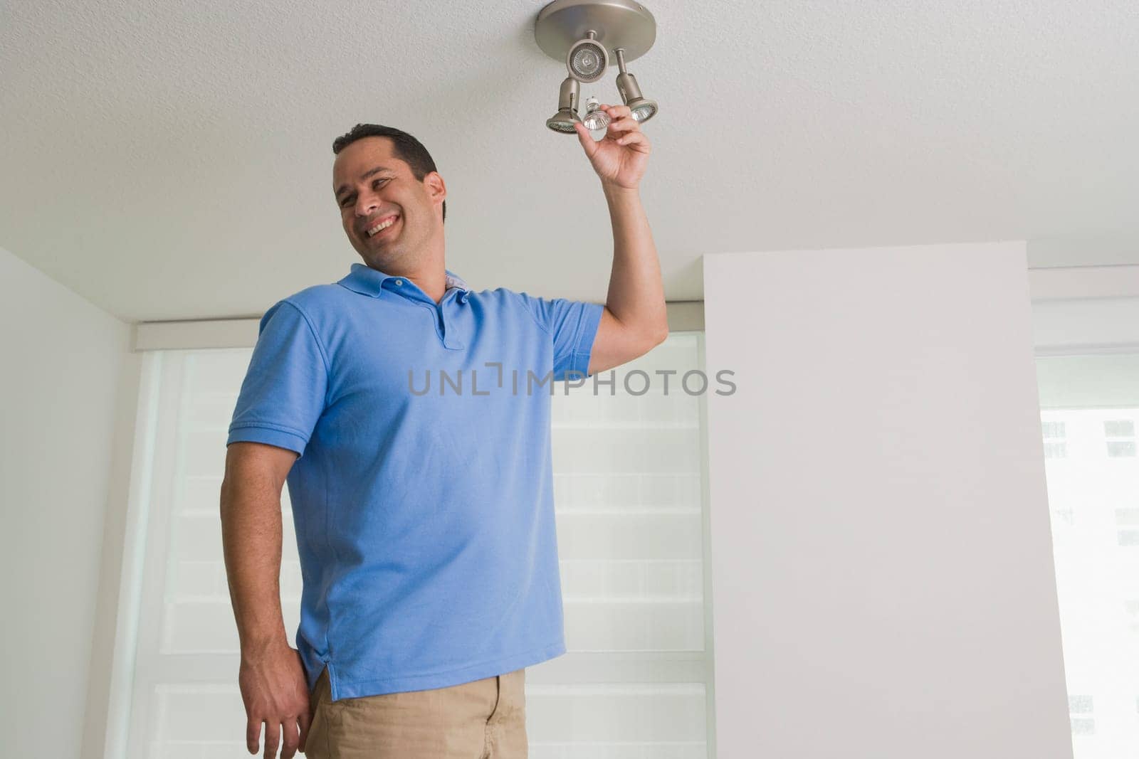 Man changing a light bulb