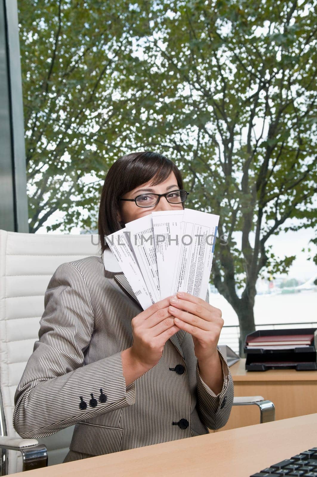 Portrait of a businesswoman holding bills