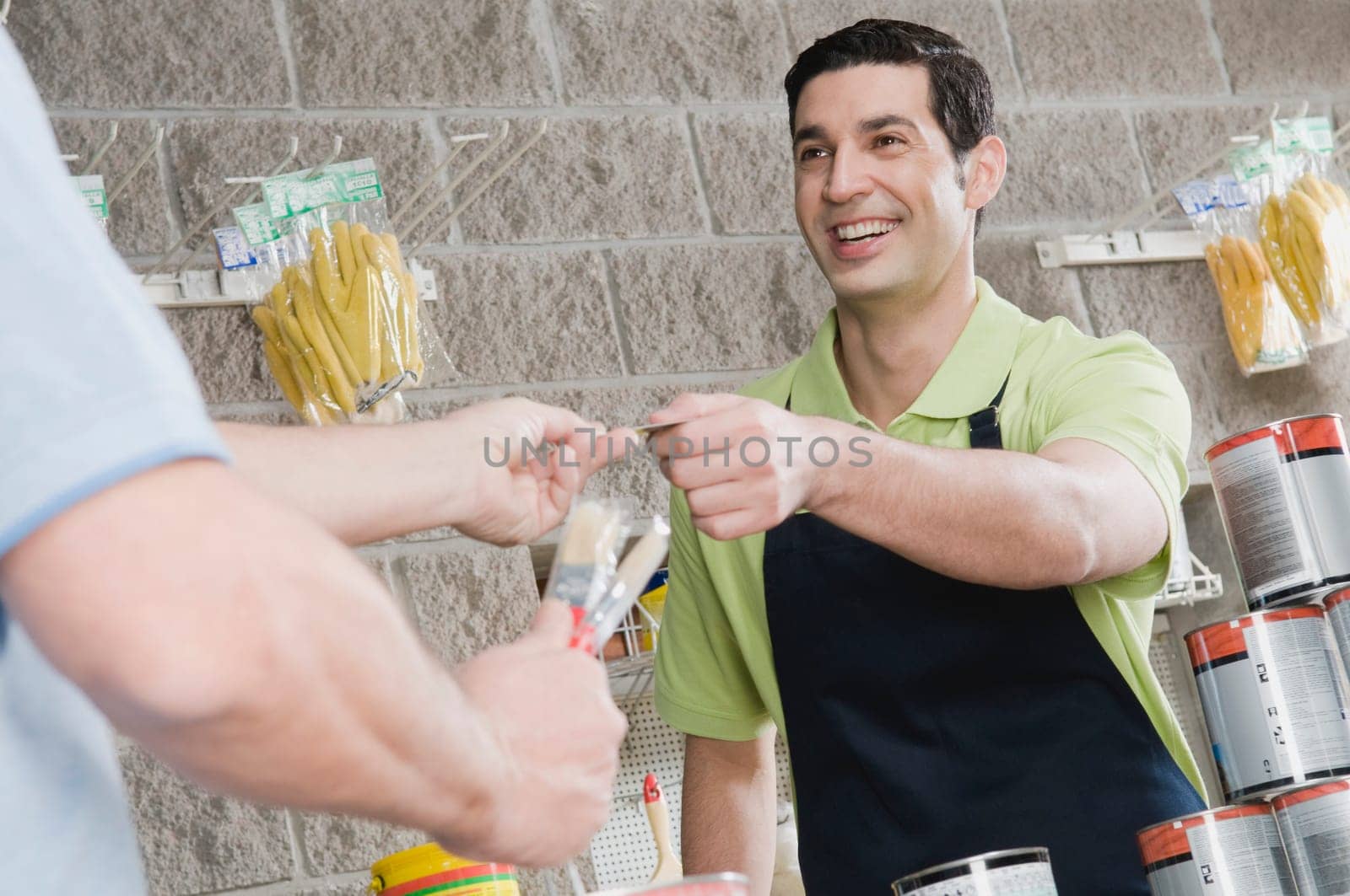 Man paying with a credit card in a hardware store