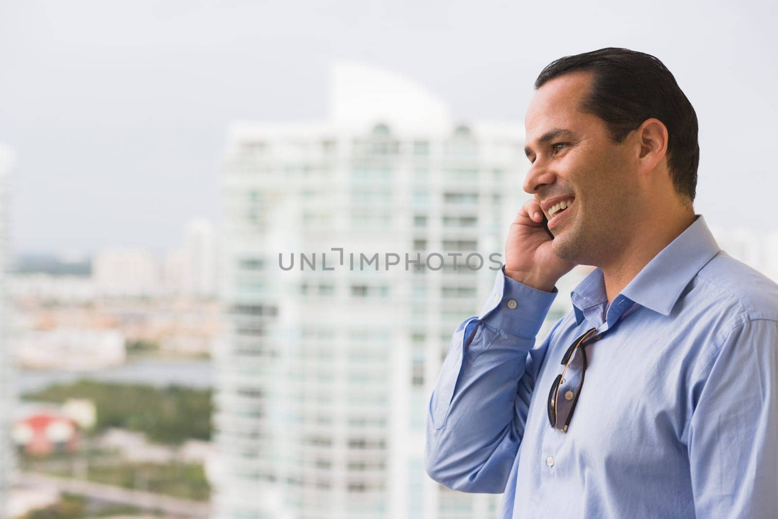 Man talking on a mobile phone and smiling