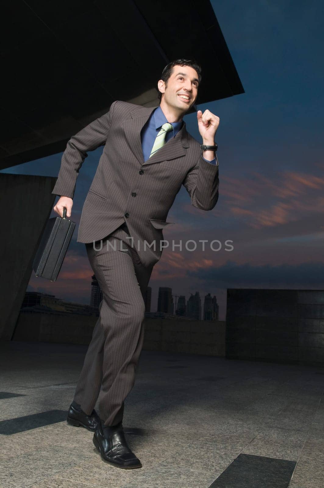 Businessman running with a briefcase