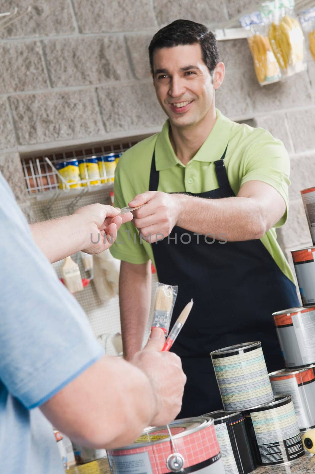 Man paying with a credit card in a hardware store