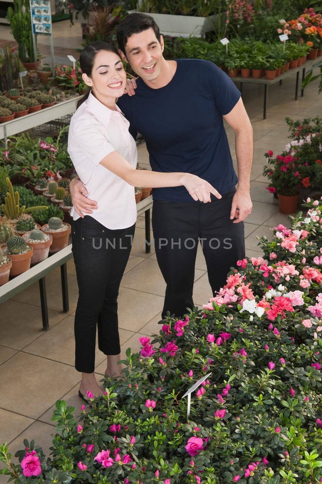 Couple choosing plants in a garden center