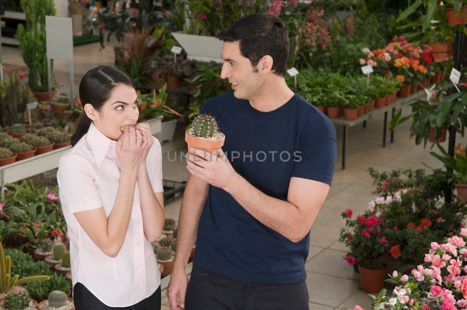 Couple choosing plants in a garden center