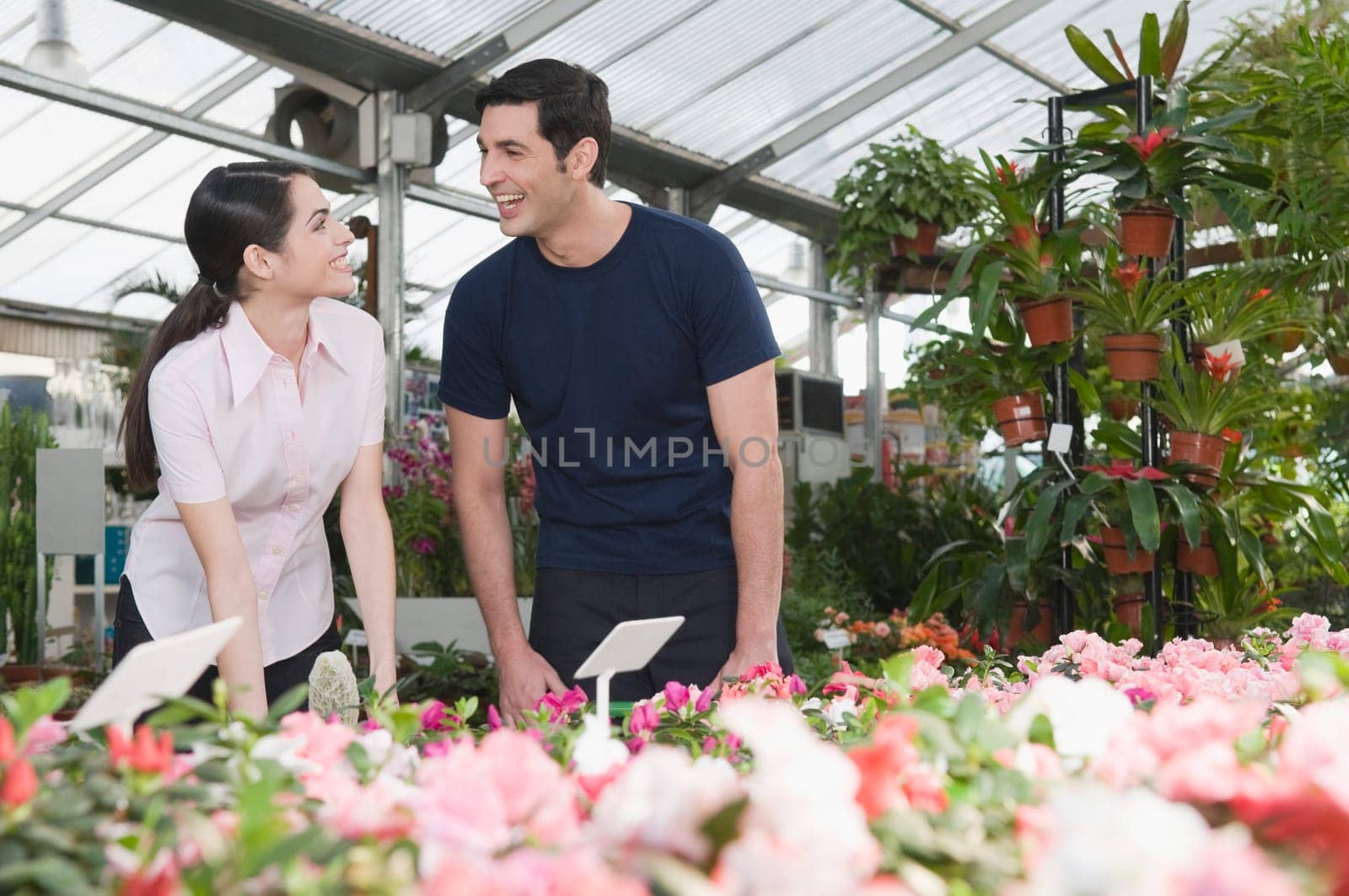 Couple smiling in a garden center
