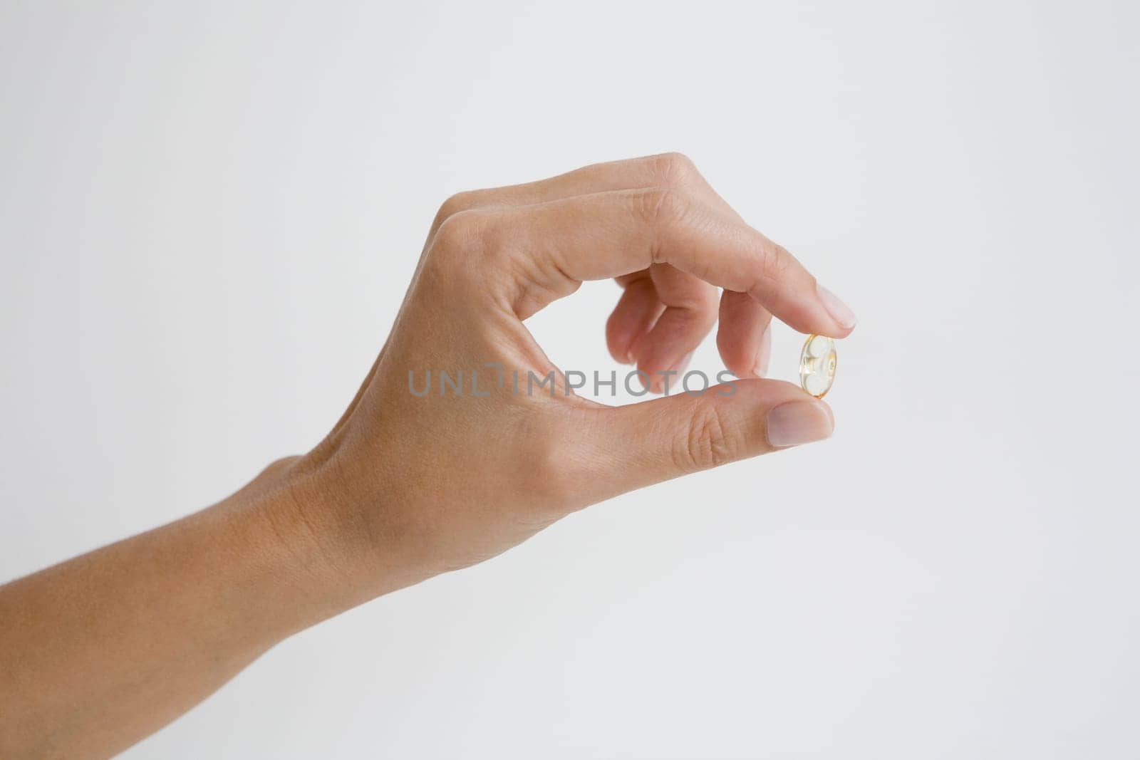 Close-up of a person's hand holding a ring