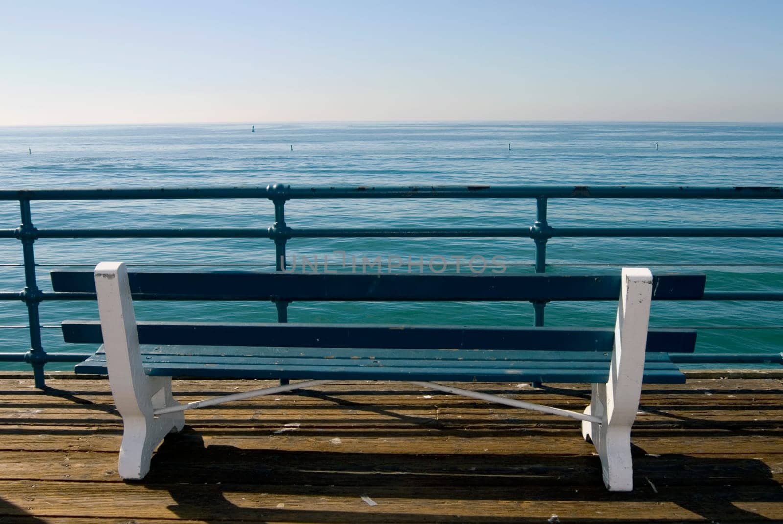 Bench overlooking the ocean on pier