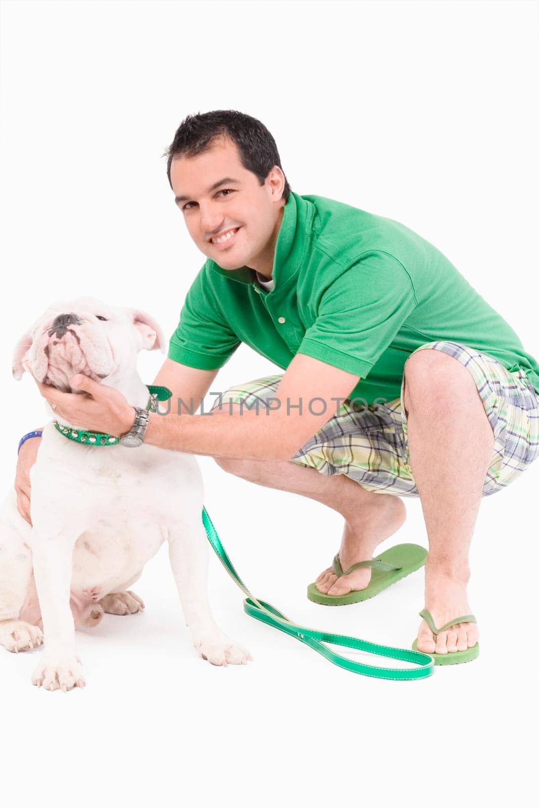 Portrait of a young man pampering his dog