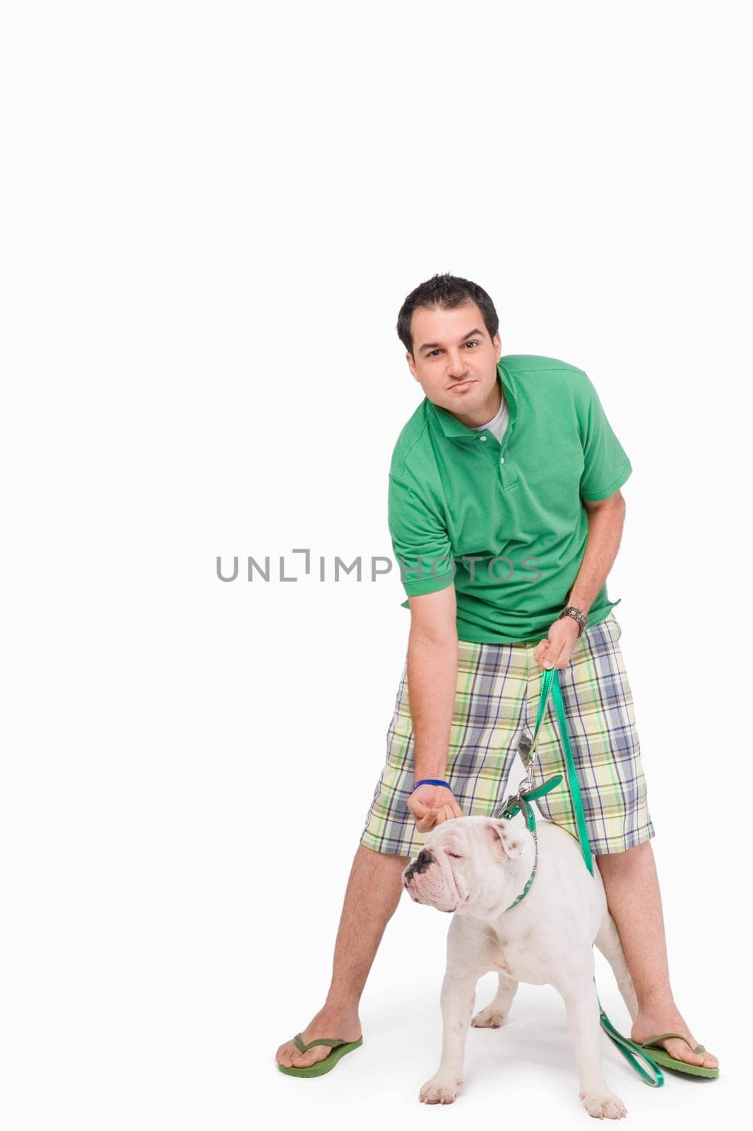 Portrait of a young man standing with a dog