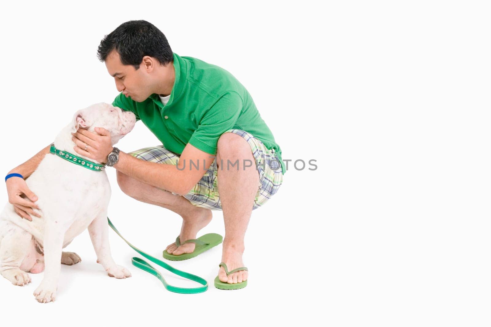 Young man pampering a dog