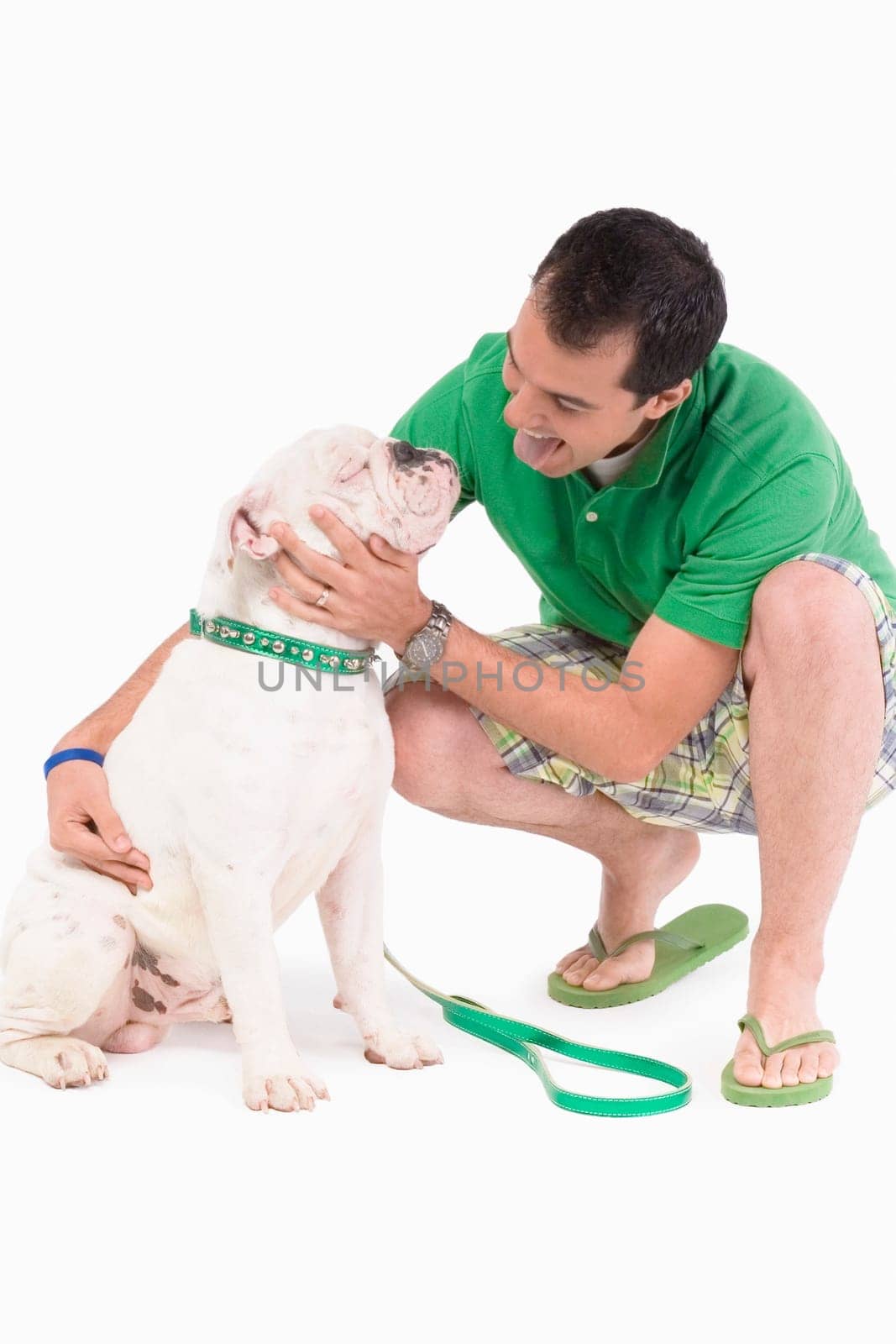 Young man pampering a dog