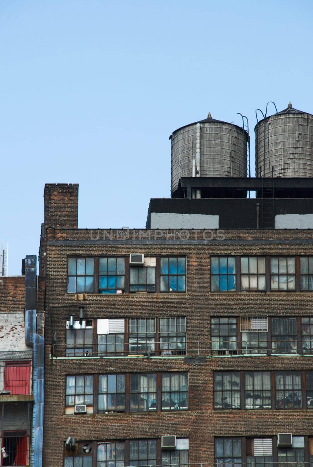 Low angle view of water tanks on an apartment building