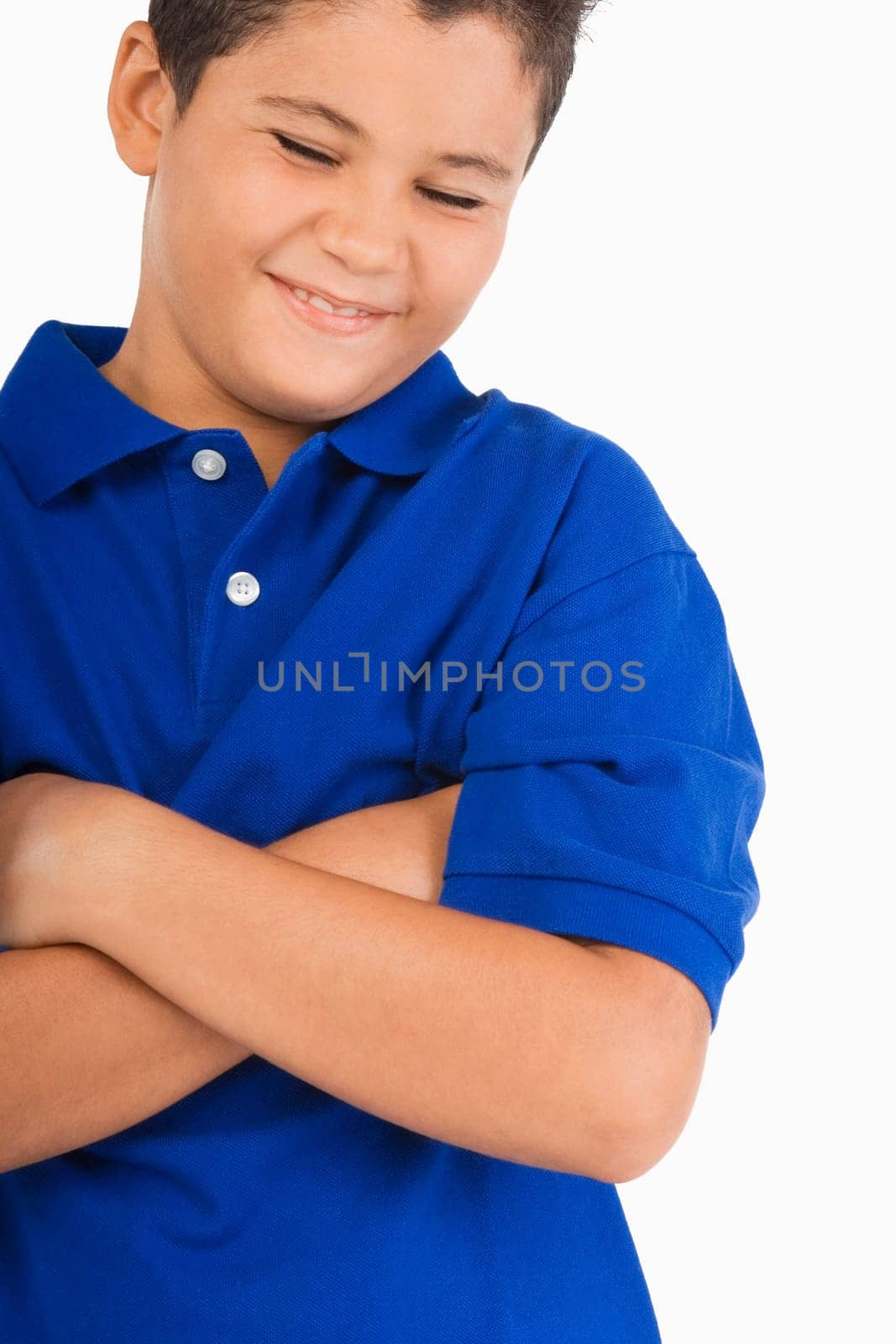 Close-up of a boy with his arms crossed