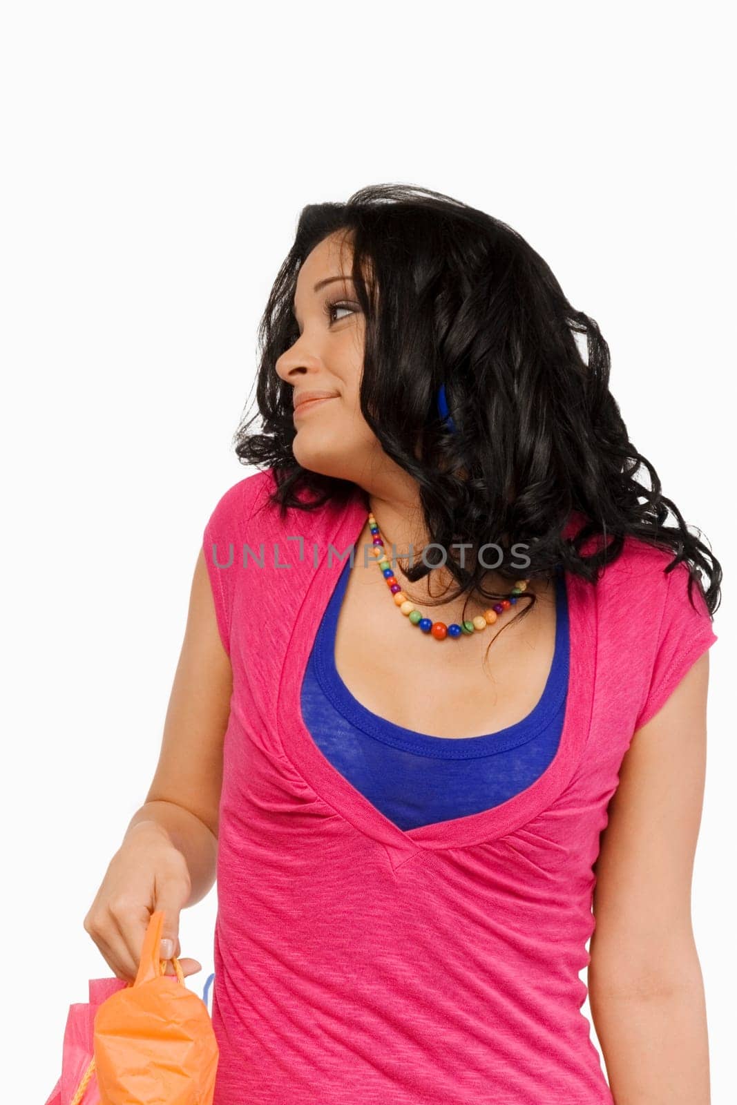 Close-up of a young woman holding a shopping bag