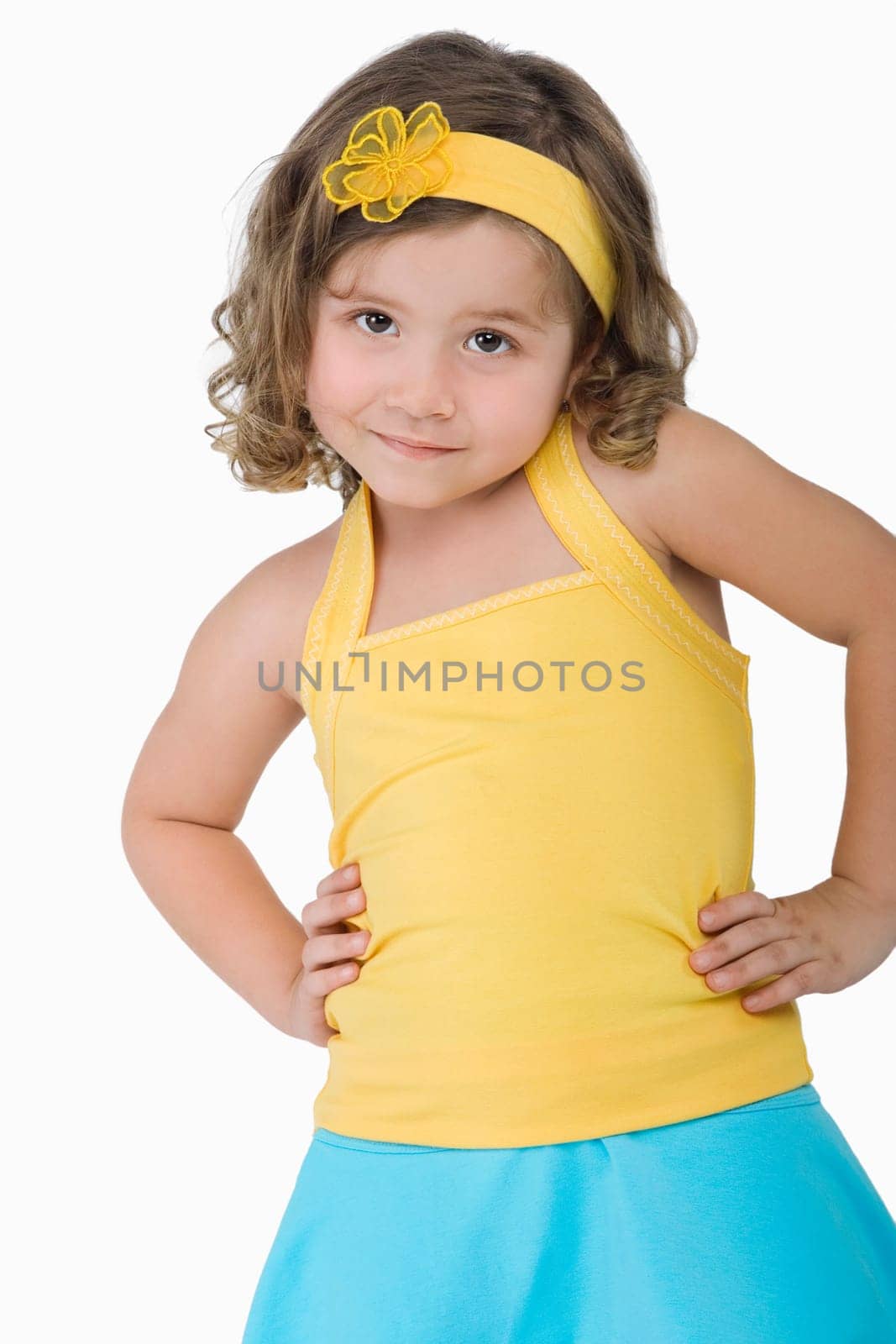 Portrait of a girl standing with arms akimbo