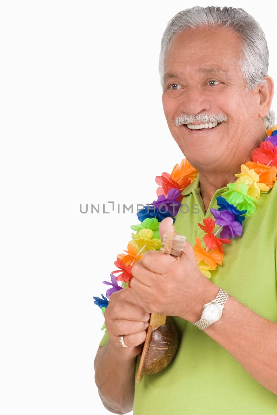 Close-up of a senior man playing ukulele and smiling