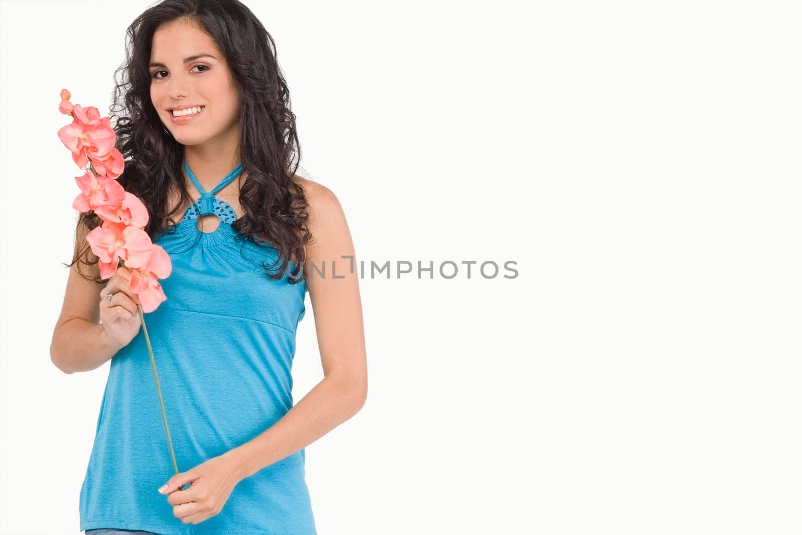 Portrait of a teenage girl holding flowers and smiling