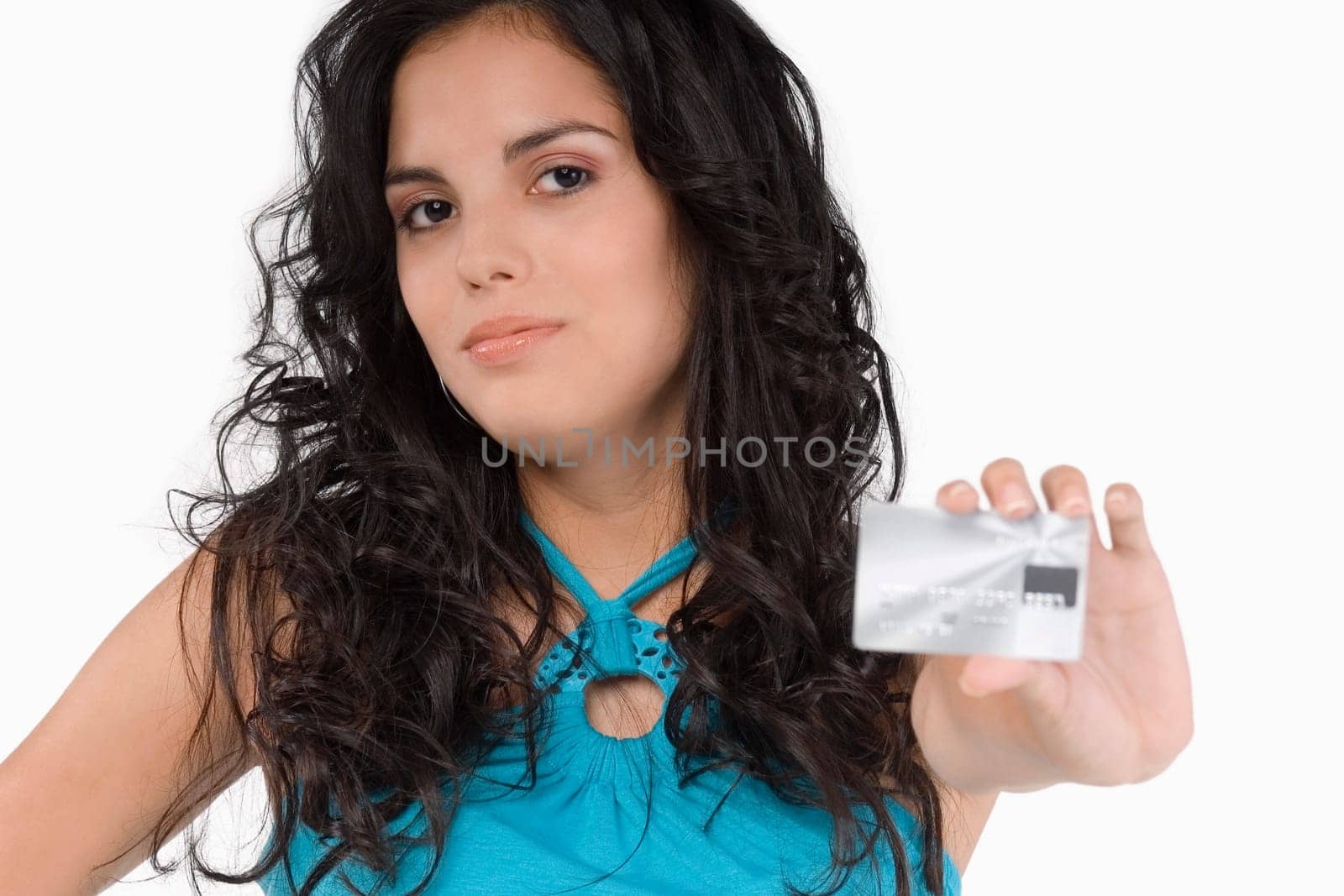 Portrait of a teenage girl showing a credit card