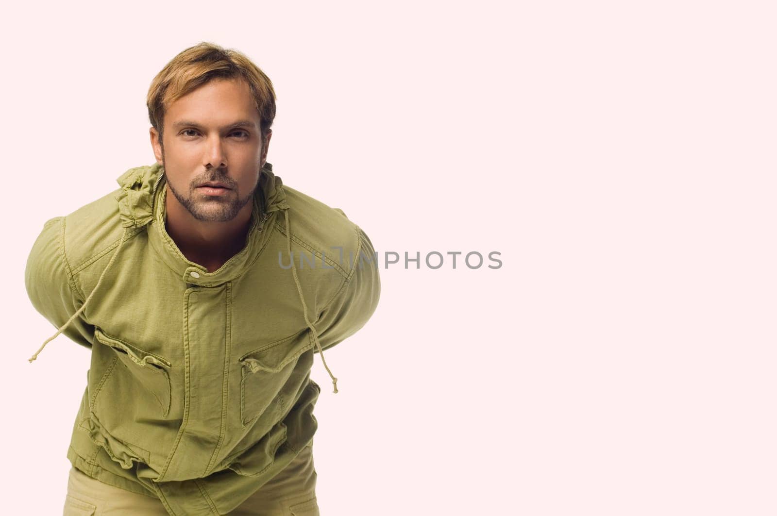 Portrait of a mid adult man bending forward