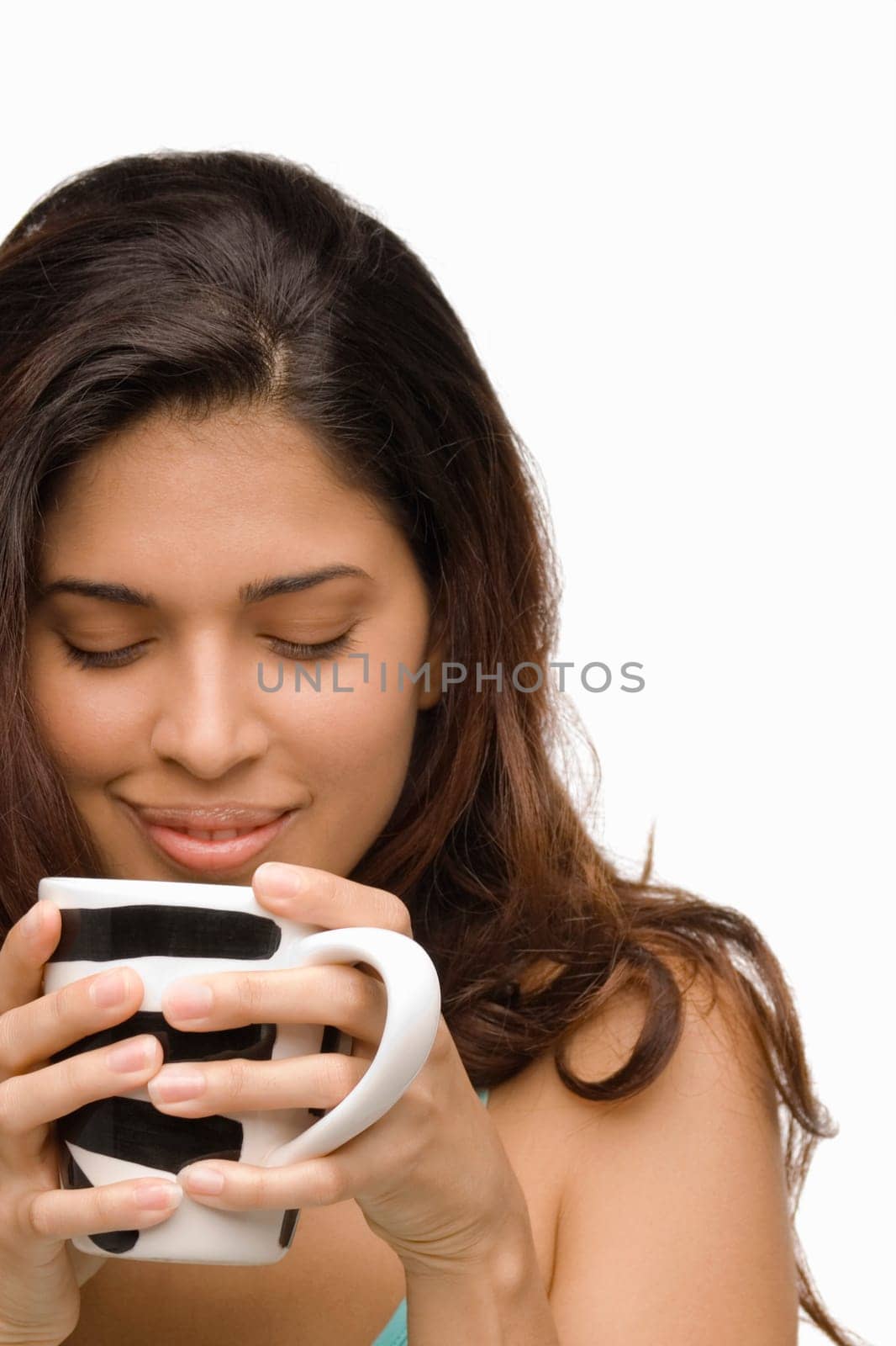 Close-up of a young woman holding a mug of coffee
