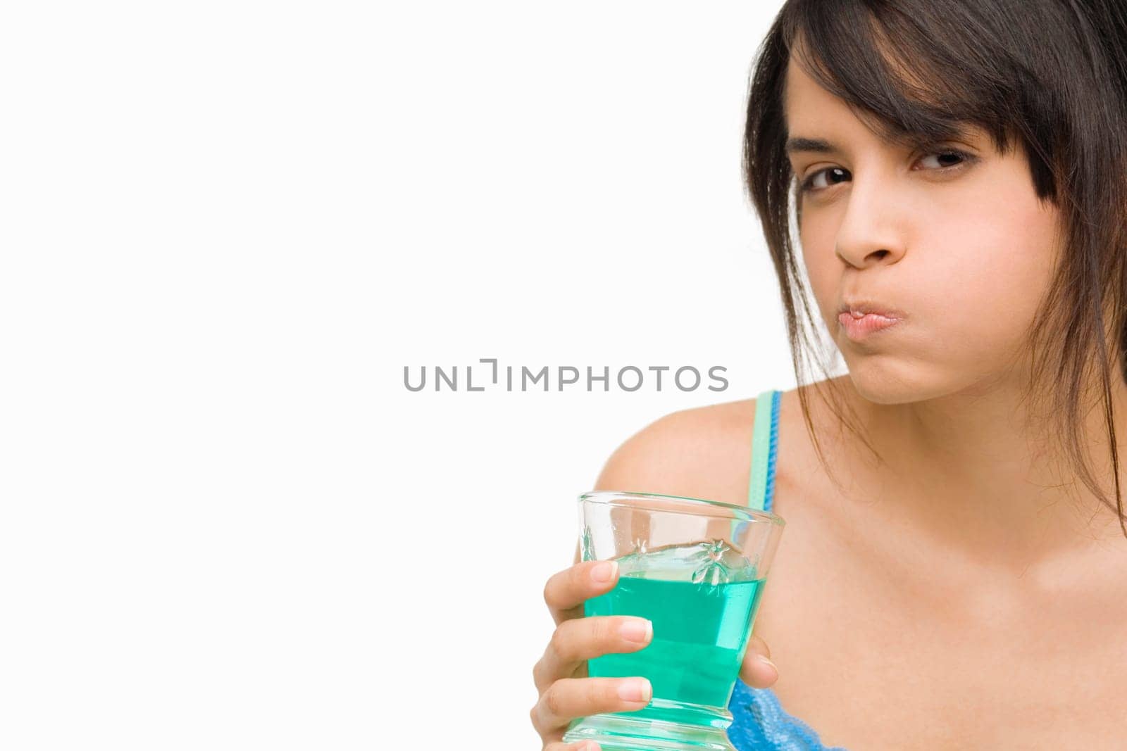 Portrait of a young woman gargling