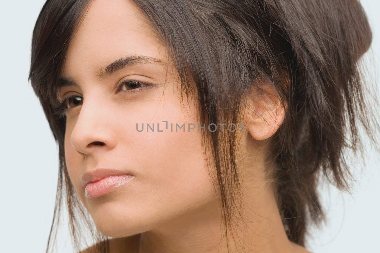 Close-up of a young woman looking serious