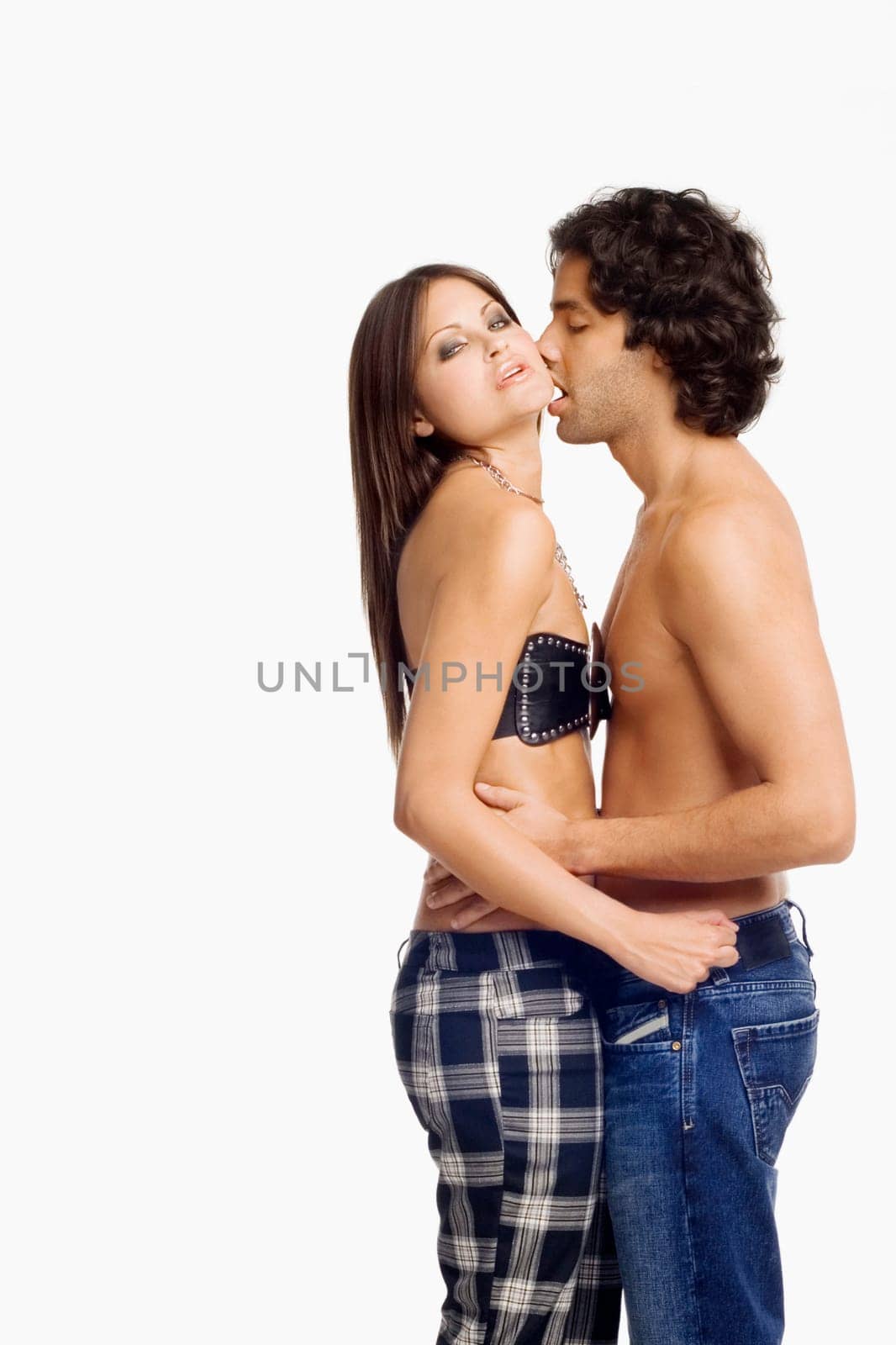 Side profile of a young man kissing a young woman