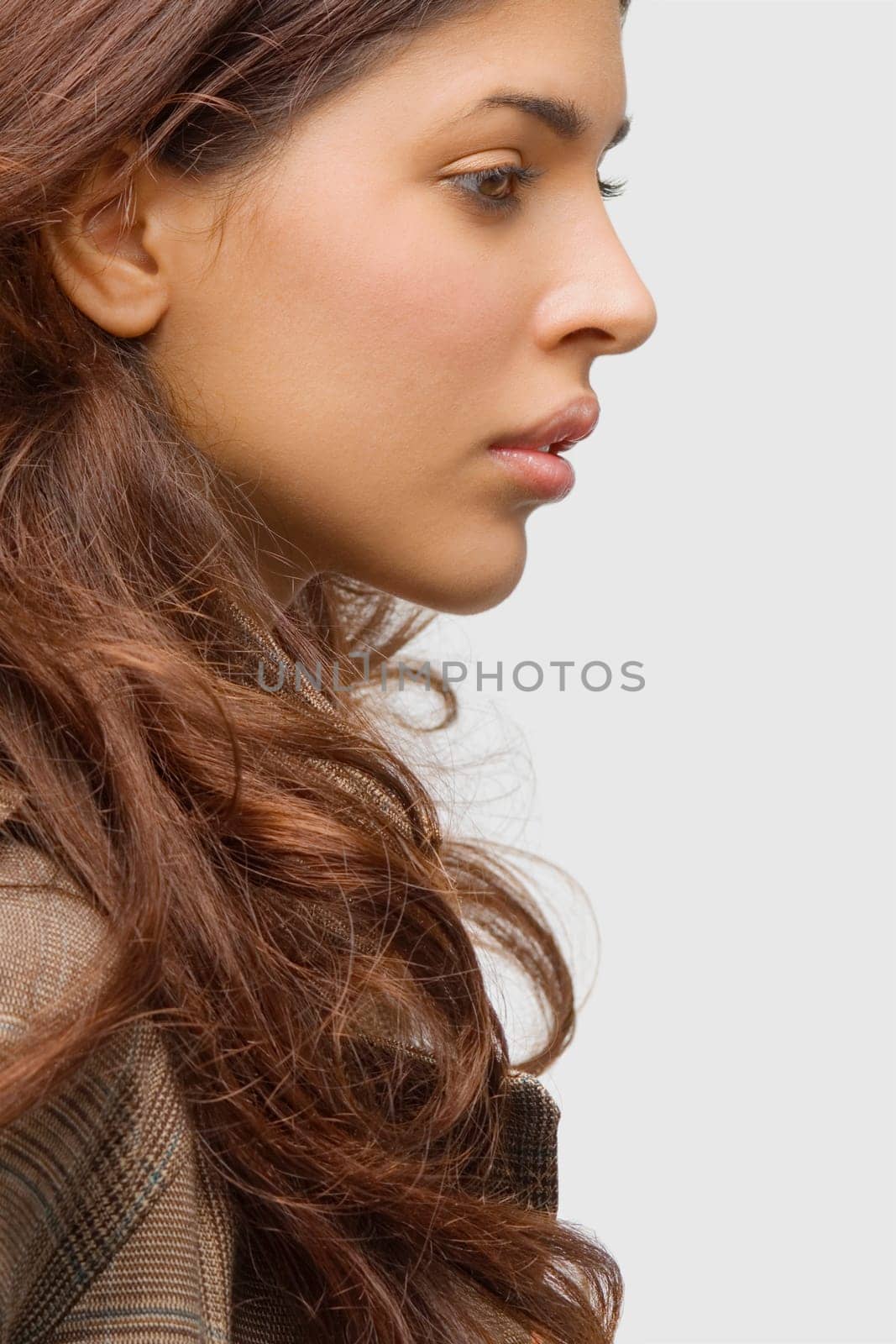 Side profile of a young woman thinking