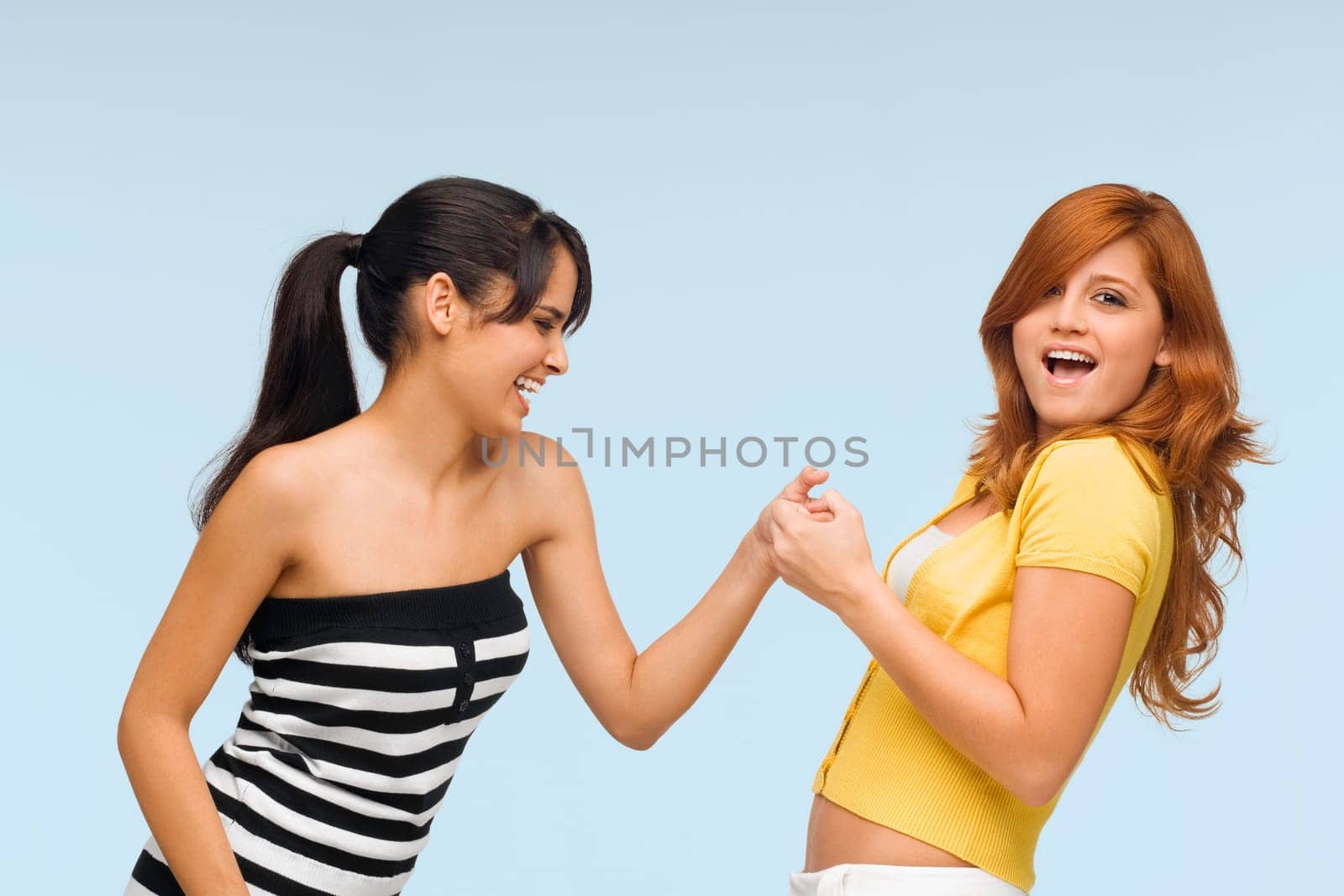 Close-up of two young women playing together