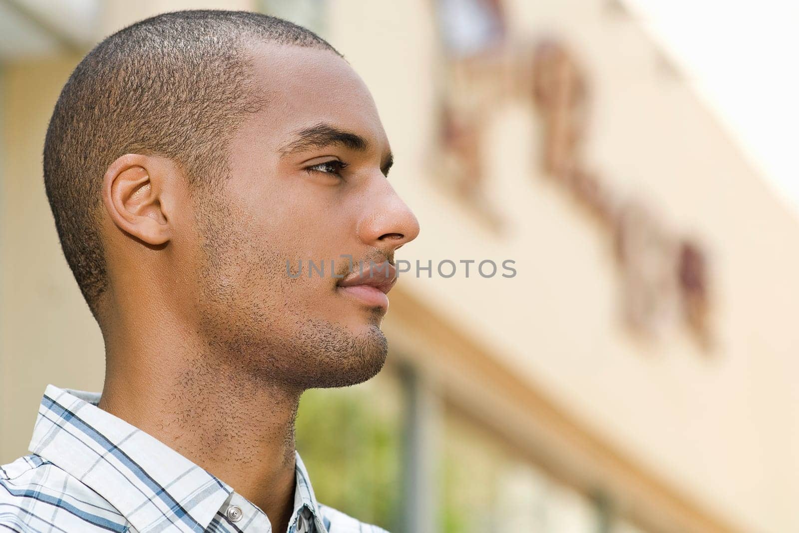 Side profile of a young man looking away
