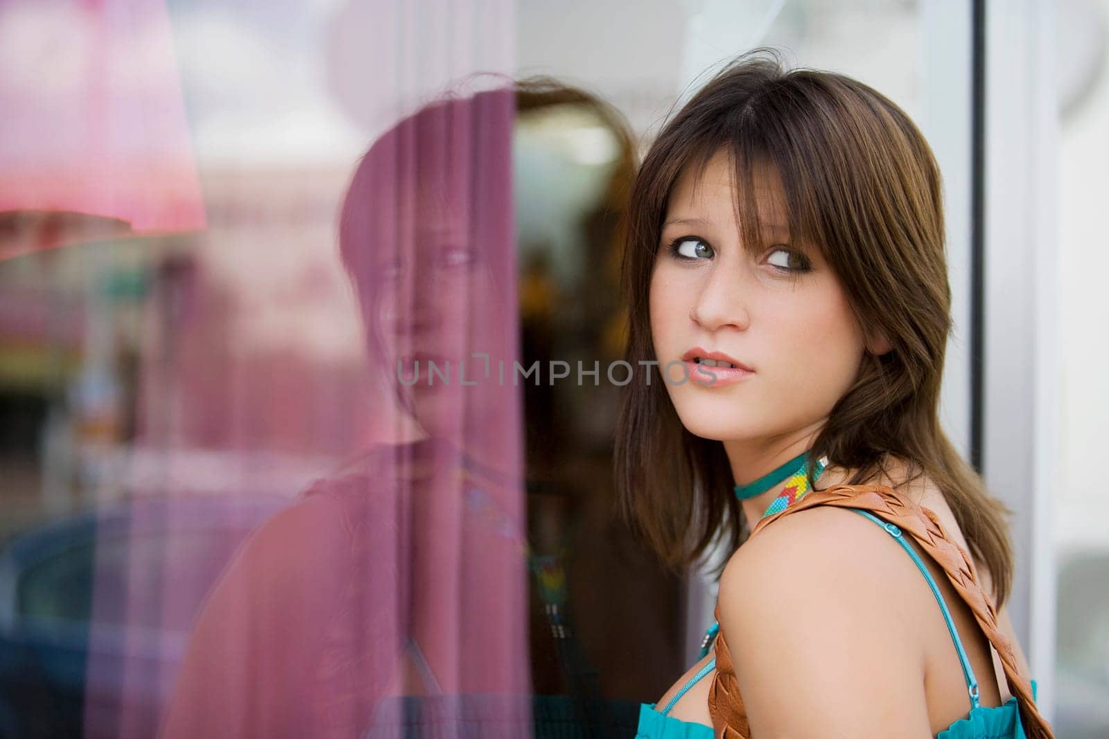 Side profile of a young woman window shopping