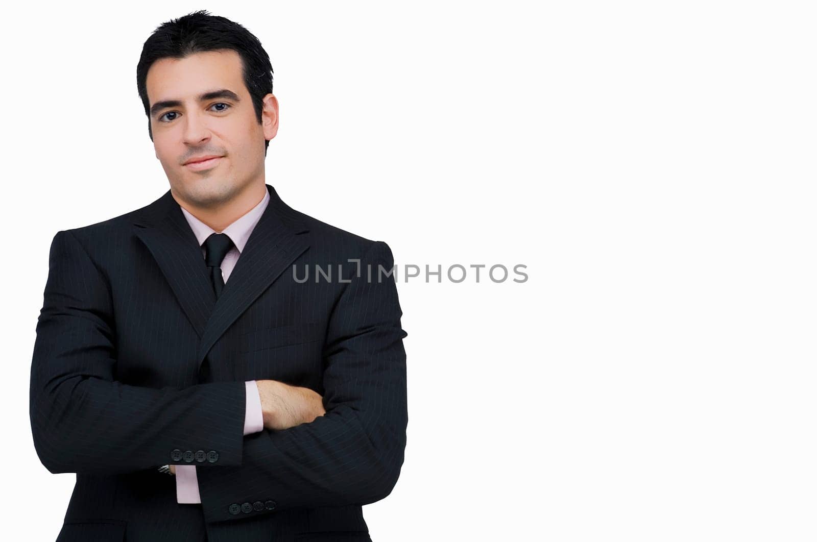 Portrait of a businessman standing with his arms crossed