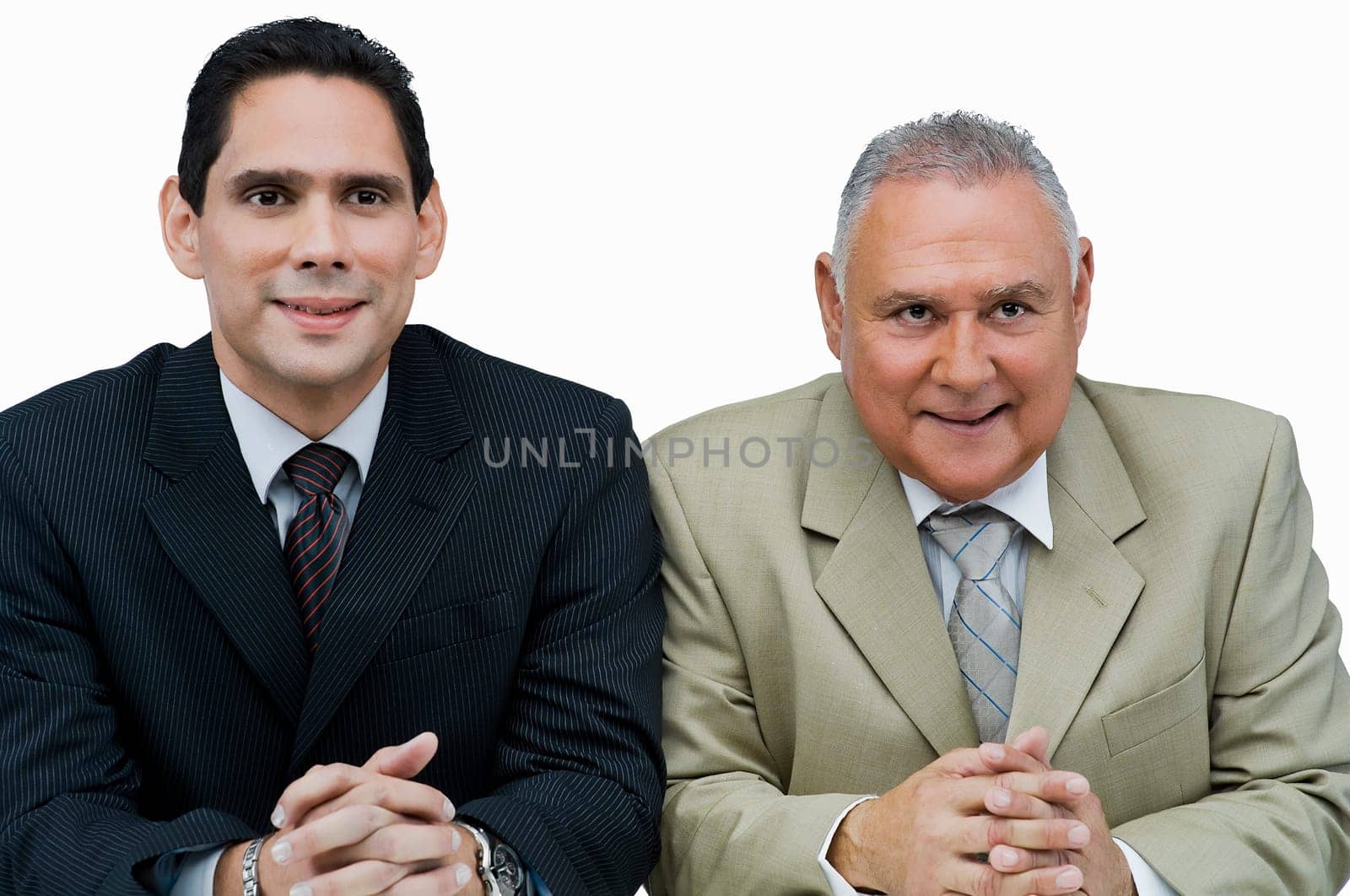Close-up of two businessmen sitting in a meeting