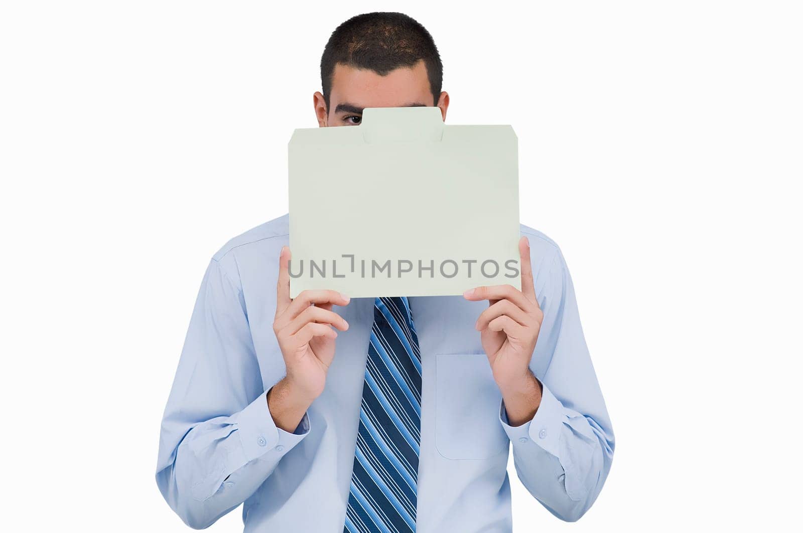 Portrait of a businessman holding a placard in front of his face
