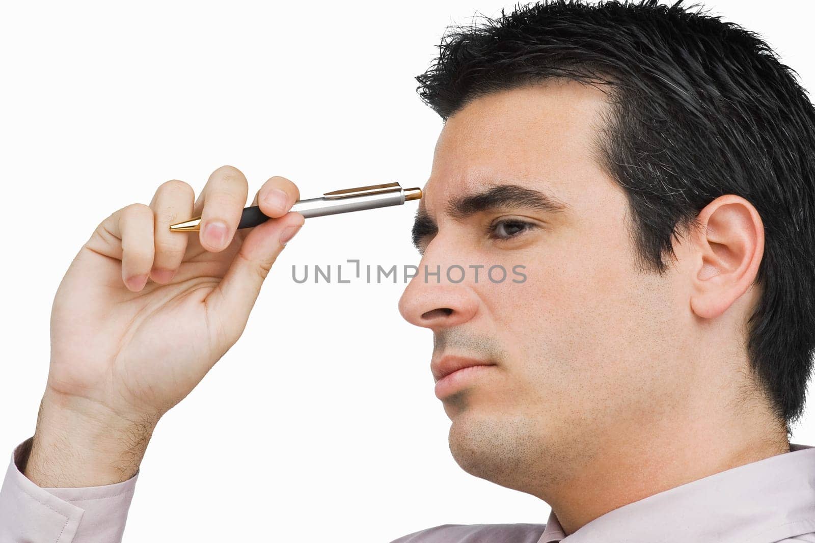 Close-up of a businessman holding a pen and thinking