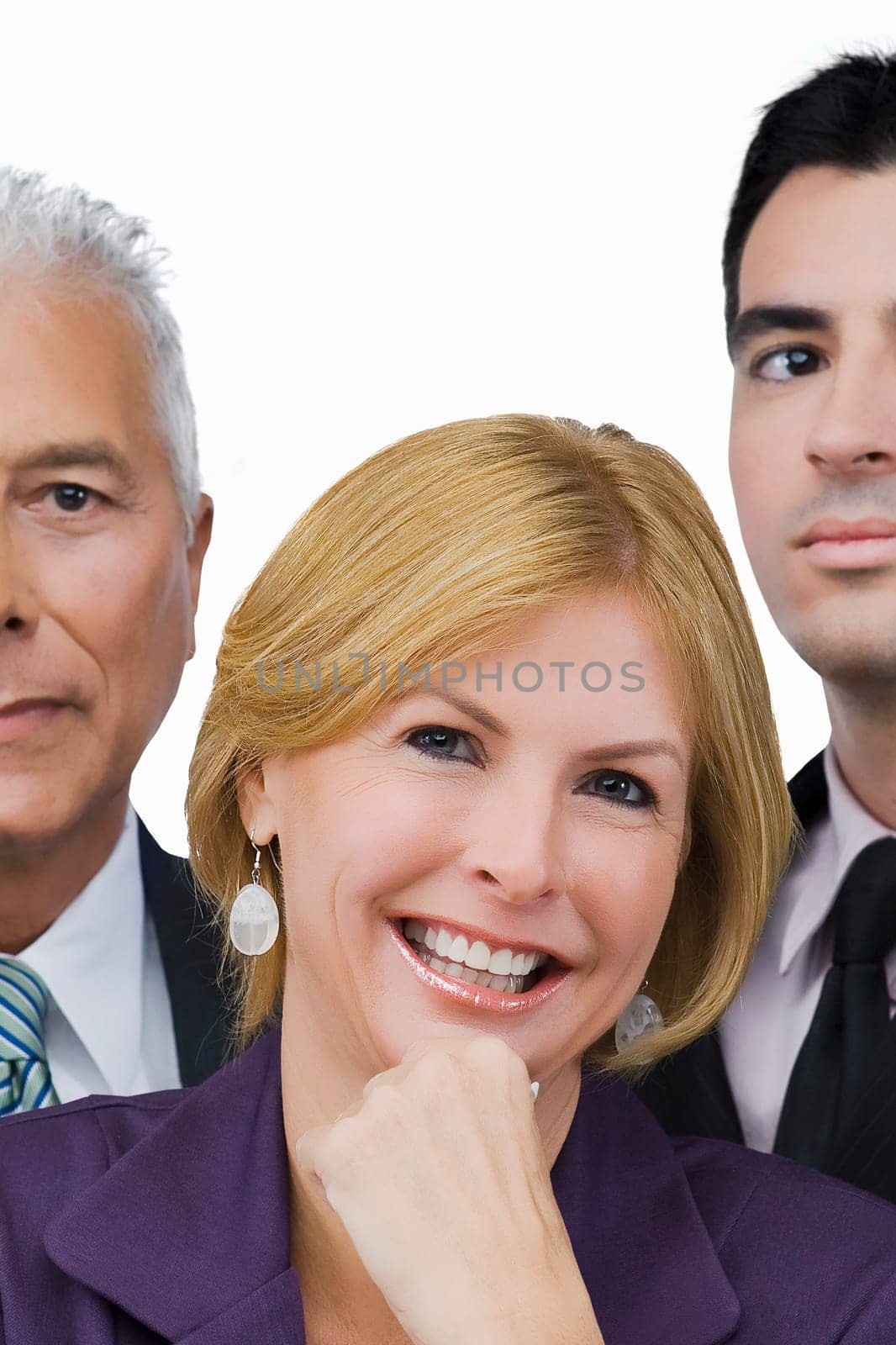 Portrait of a businesswoman smiling with two businessmen beside her