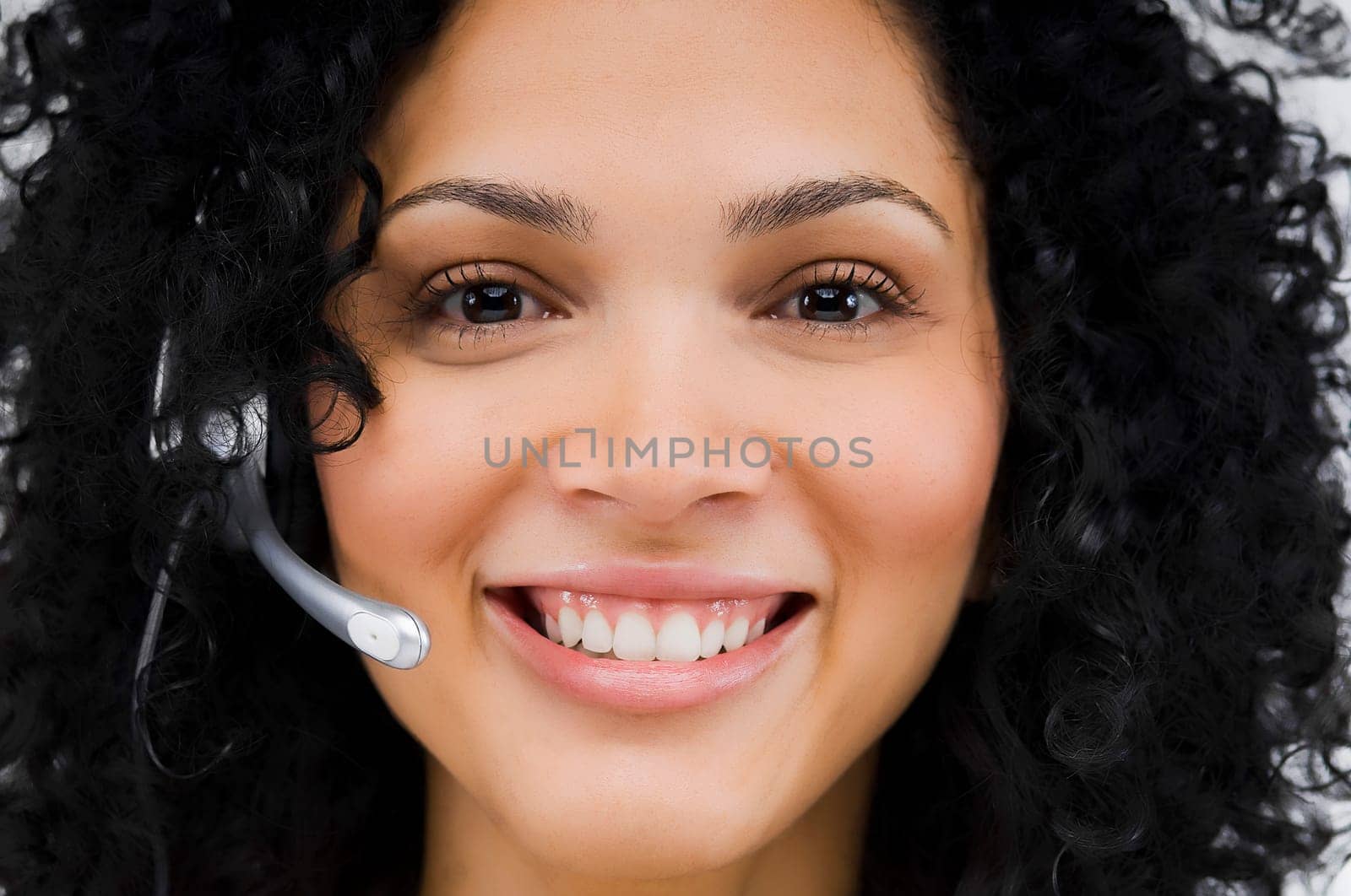 Close-up of a female customer service representative wearing a headset