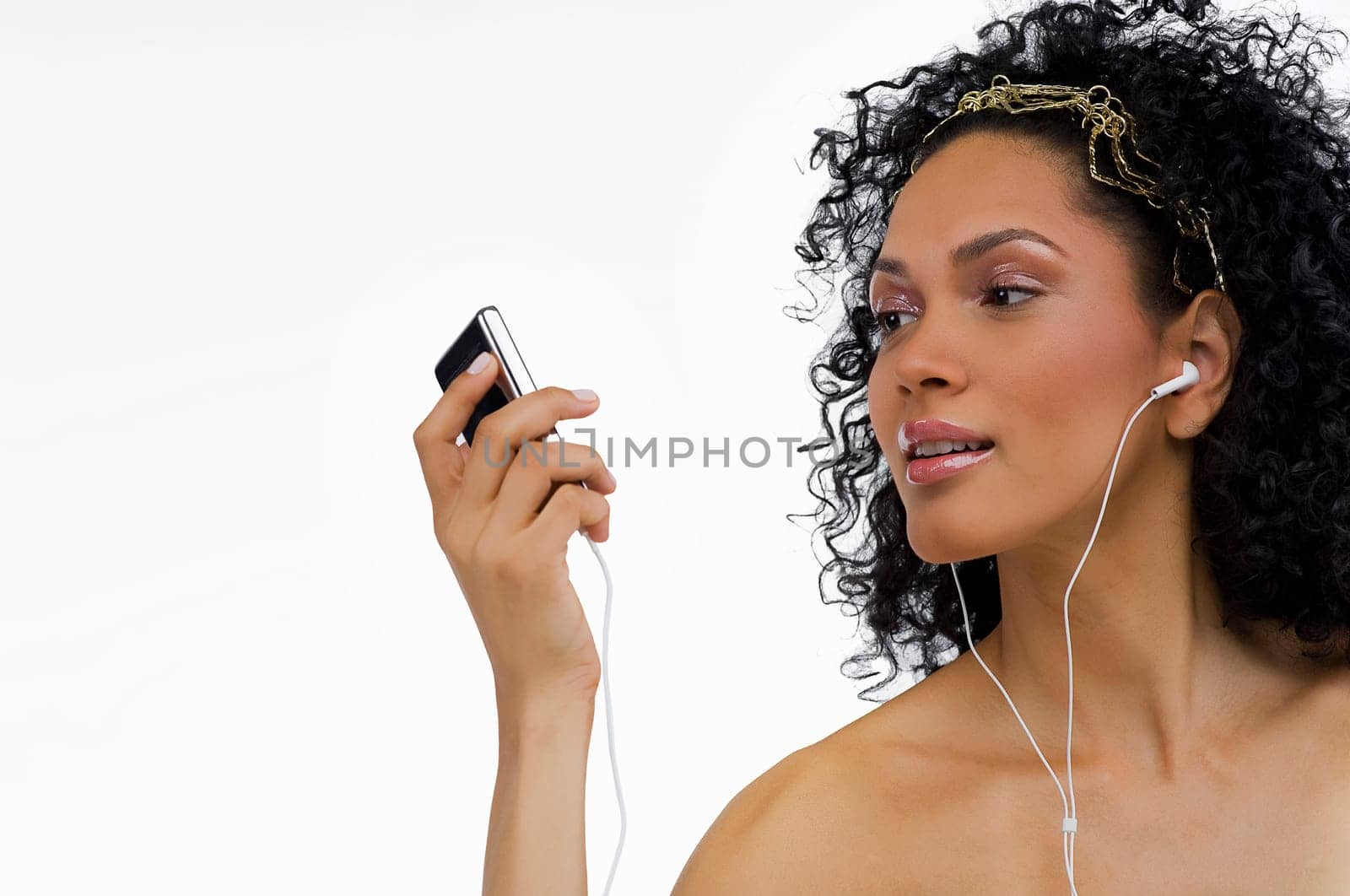 Close-up of a young woman listening to an MP3 player