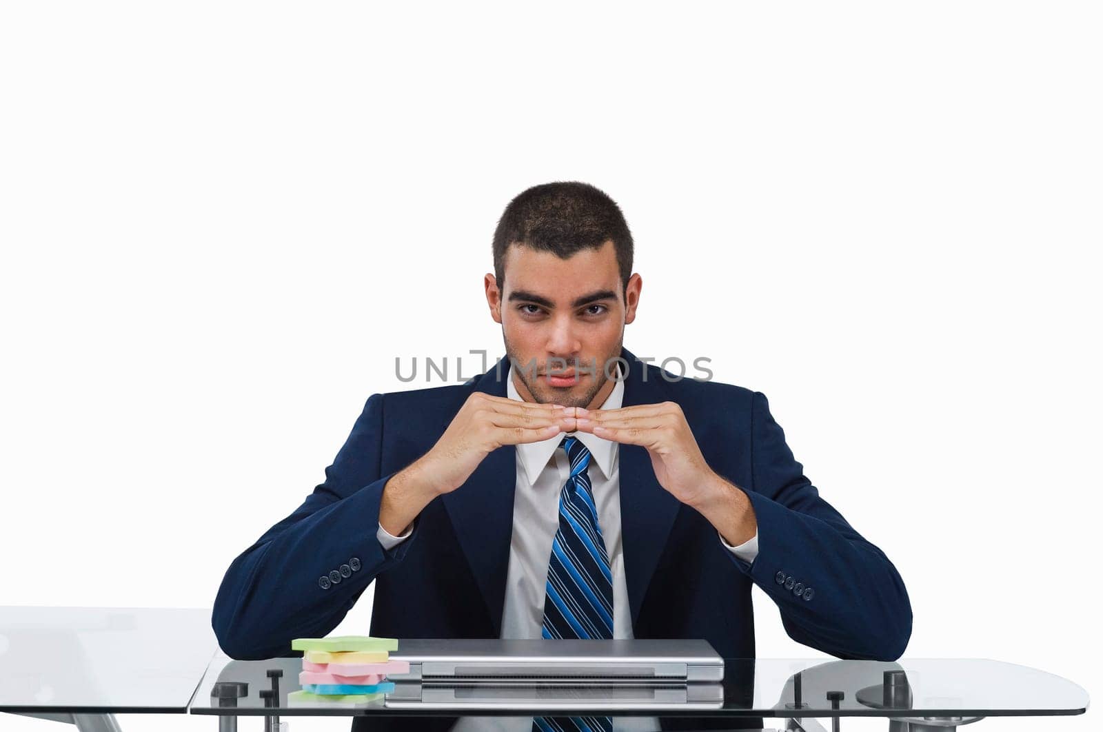 Portrait of a businessman sitting at a desk and gesturing