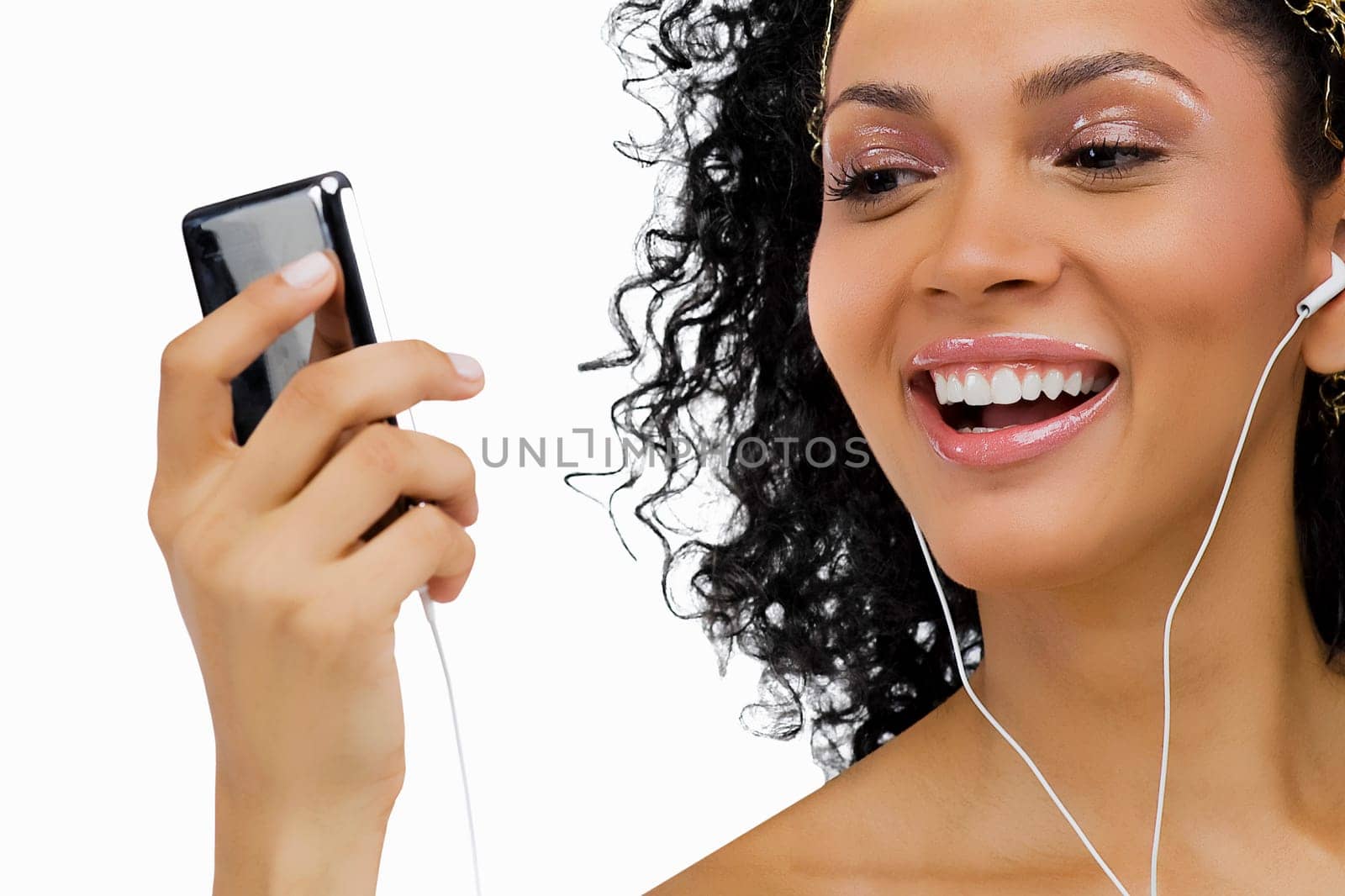 Close-up of a young woman listening to an MP3 player