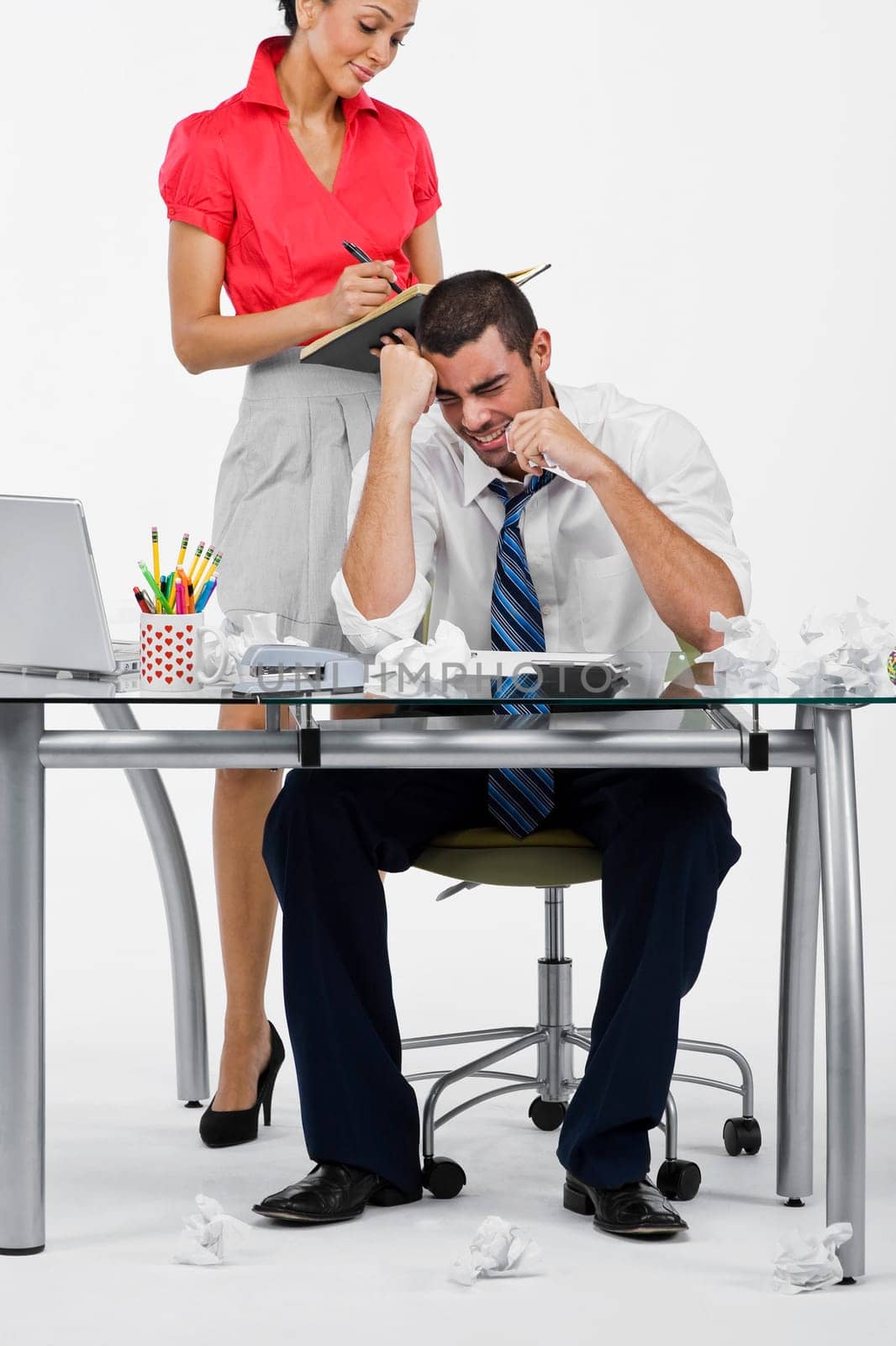 Businessman looking frustrated with a businesswoman standing behind him