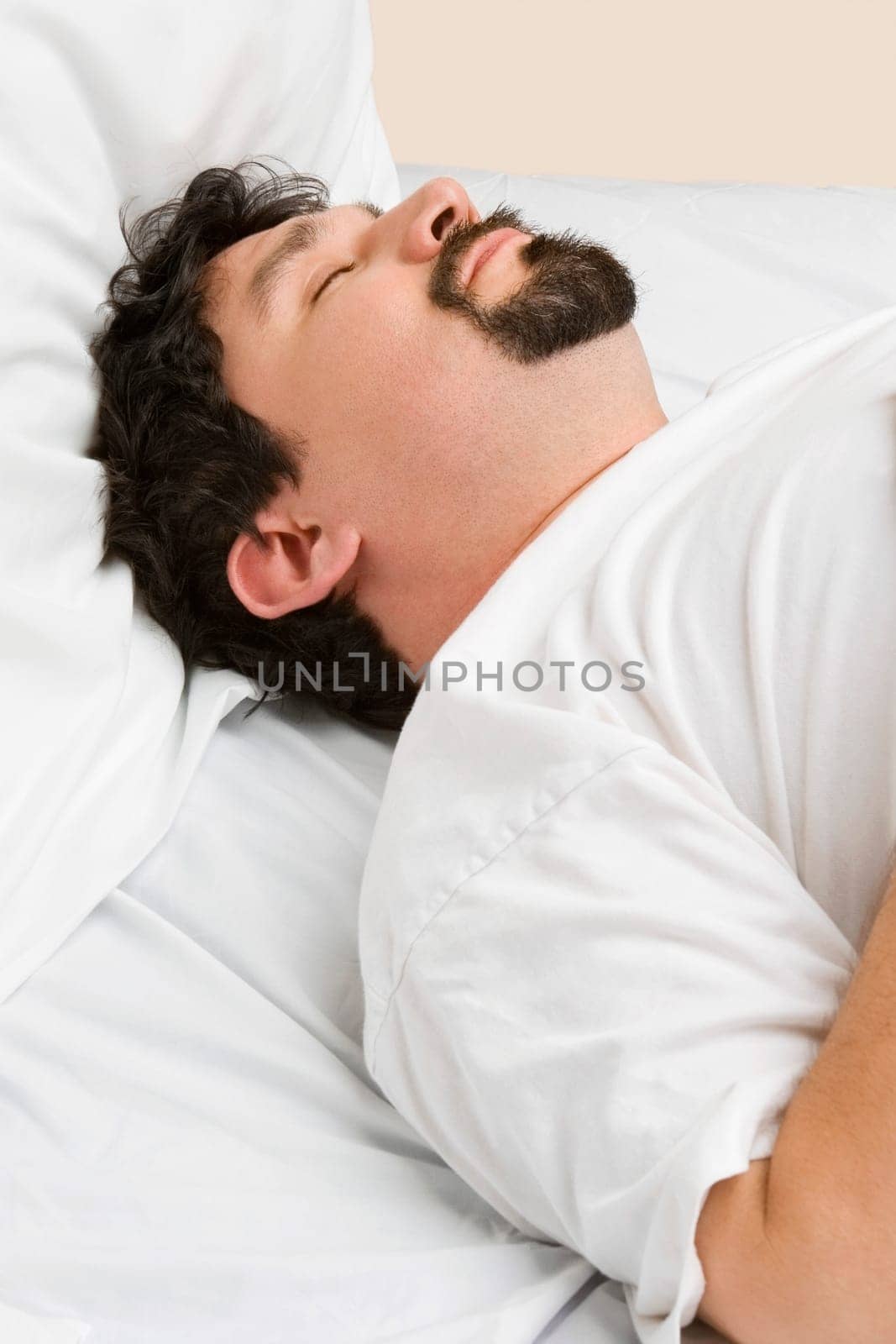 Mid adult man sleeping on the bed